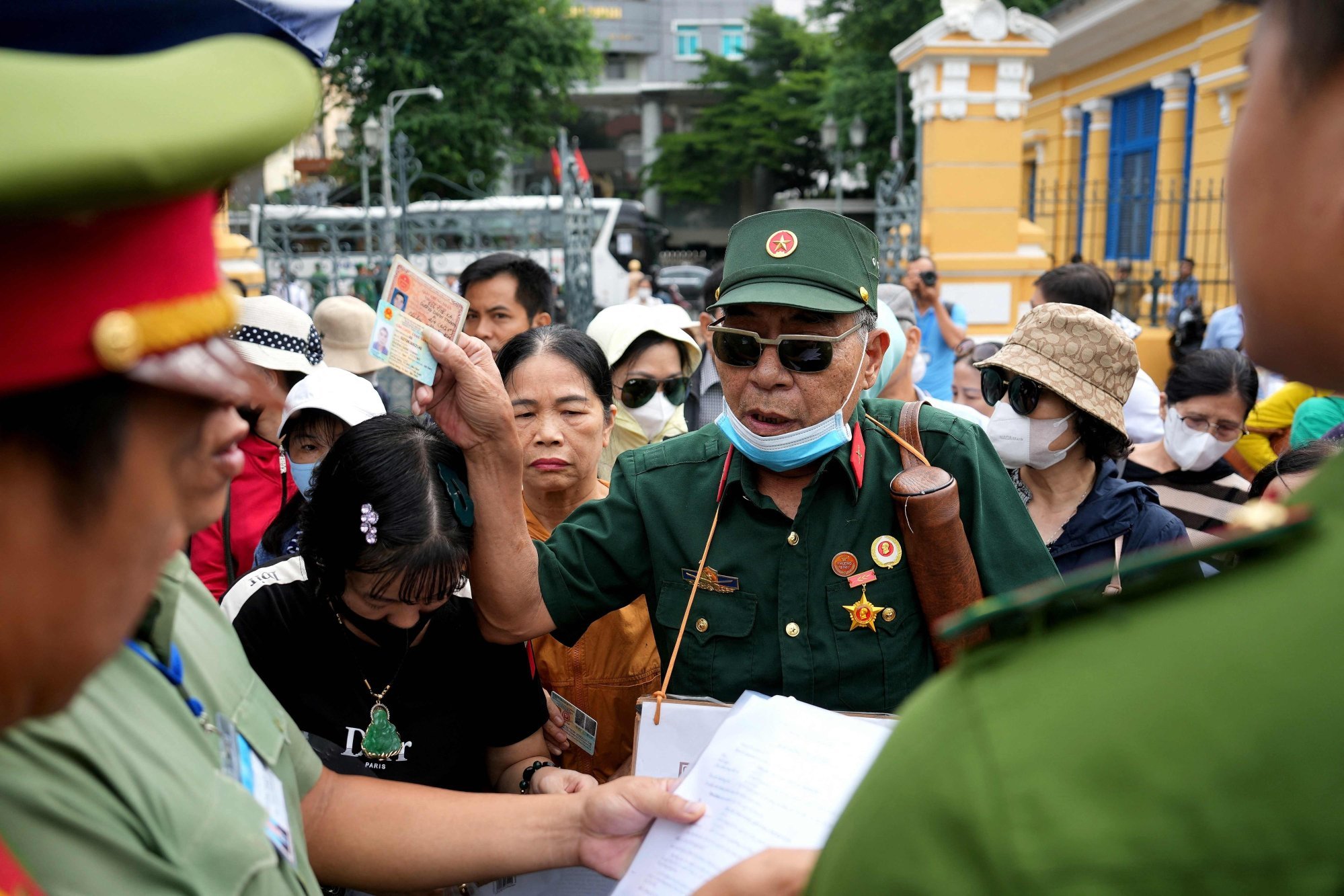 A Vietnam war veteran and fraud victim arrives with other victims to attend a court hearing involving Vietnamese tycoon Truong My Lan in Ho Chi Minh City last September. Photo: AFP A Vietnam war veteran and fraud victim arrives with other victims to attend a court hearing involving Vietnamese tycoon Truong My Lan in Ho Chi Minh City last September. Photo: AFP