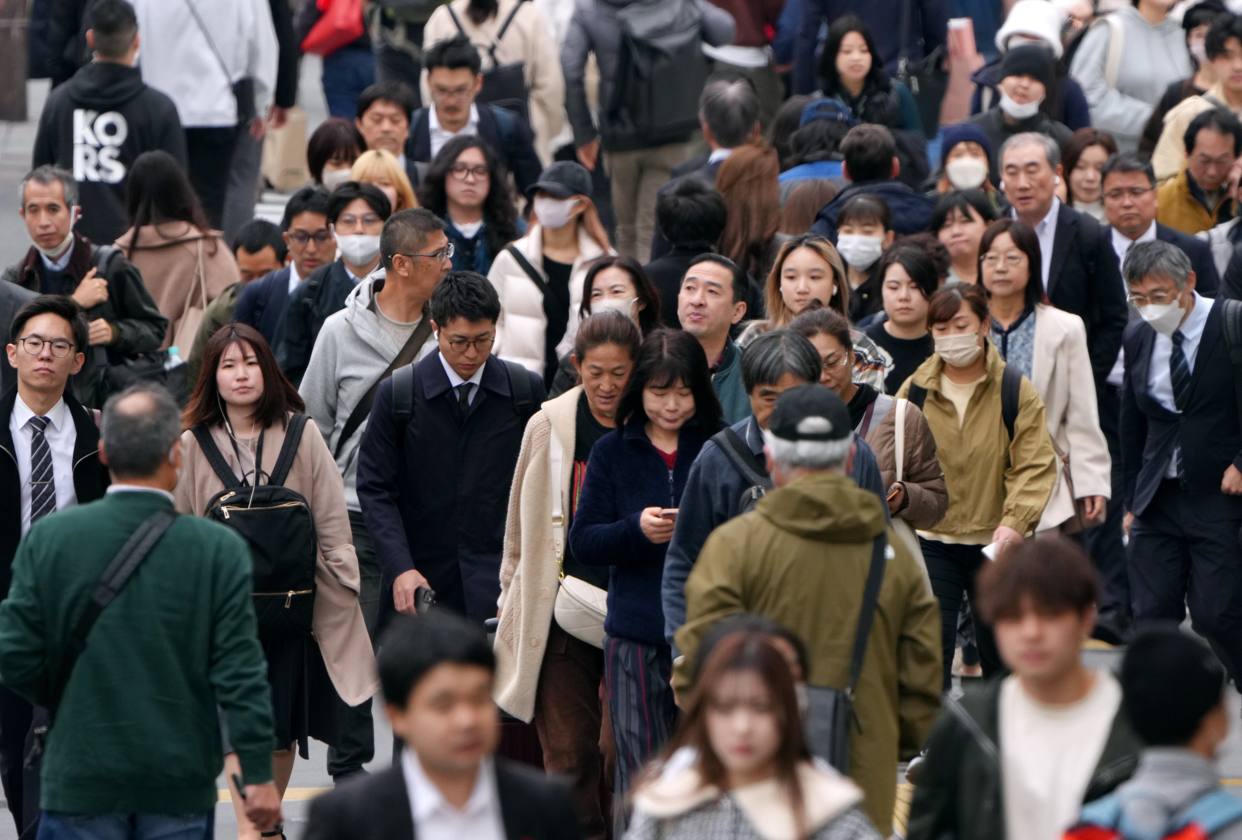 Pedestrians cross a road in Tokyo. Only two countries – France and Turkey – reported a higher share of respondents believing their nation is in decline. Photo: EPA-EFE
