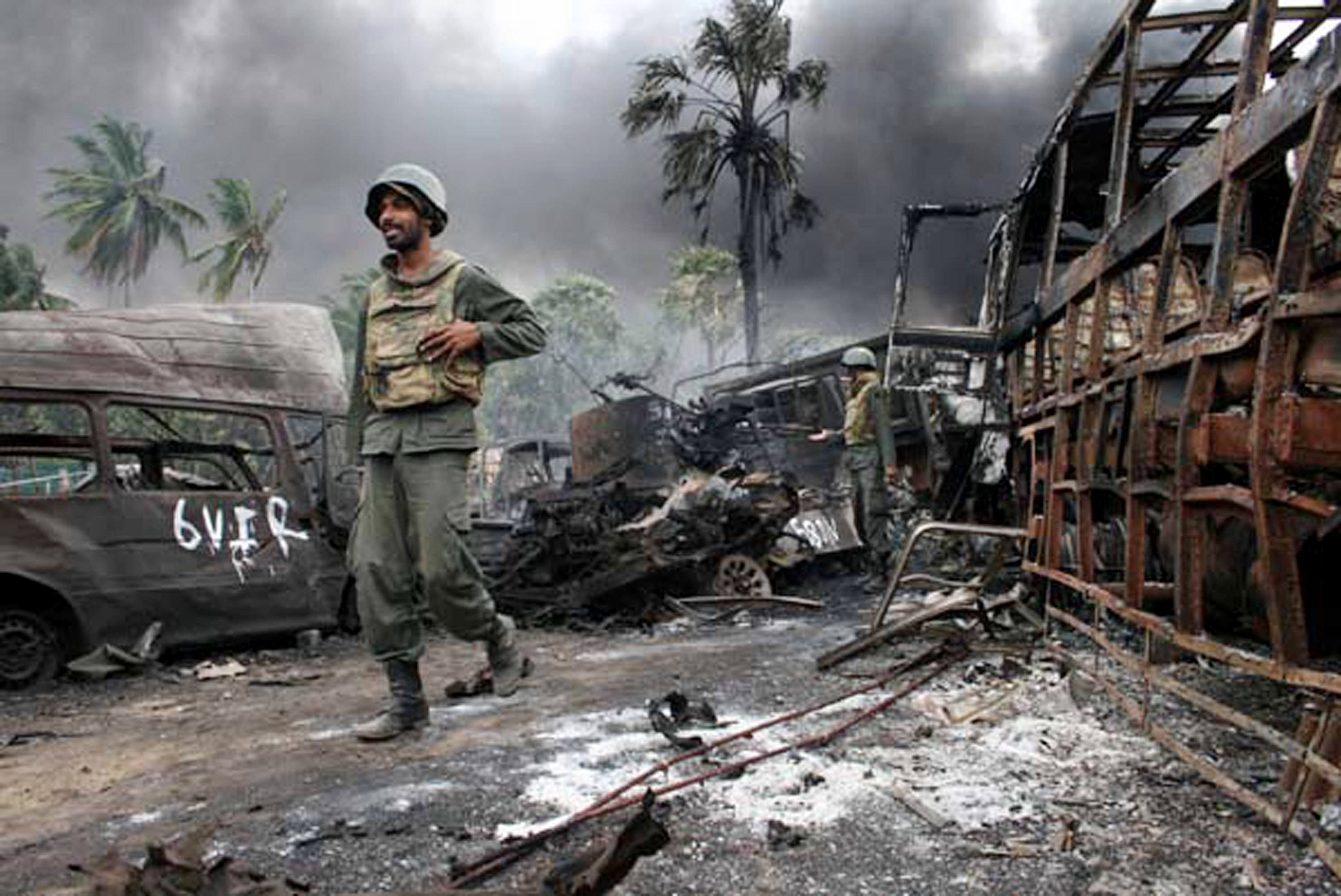 Sri Lankan troops walk among debris in a war zone during the final days of the Tamil separatist war on the Indian Ocean island in 2009. Photo: Sri Lanka Defence Ministry / AFP