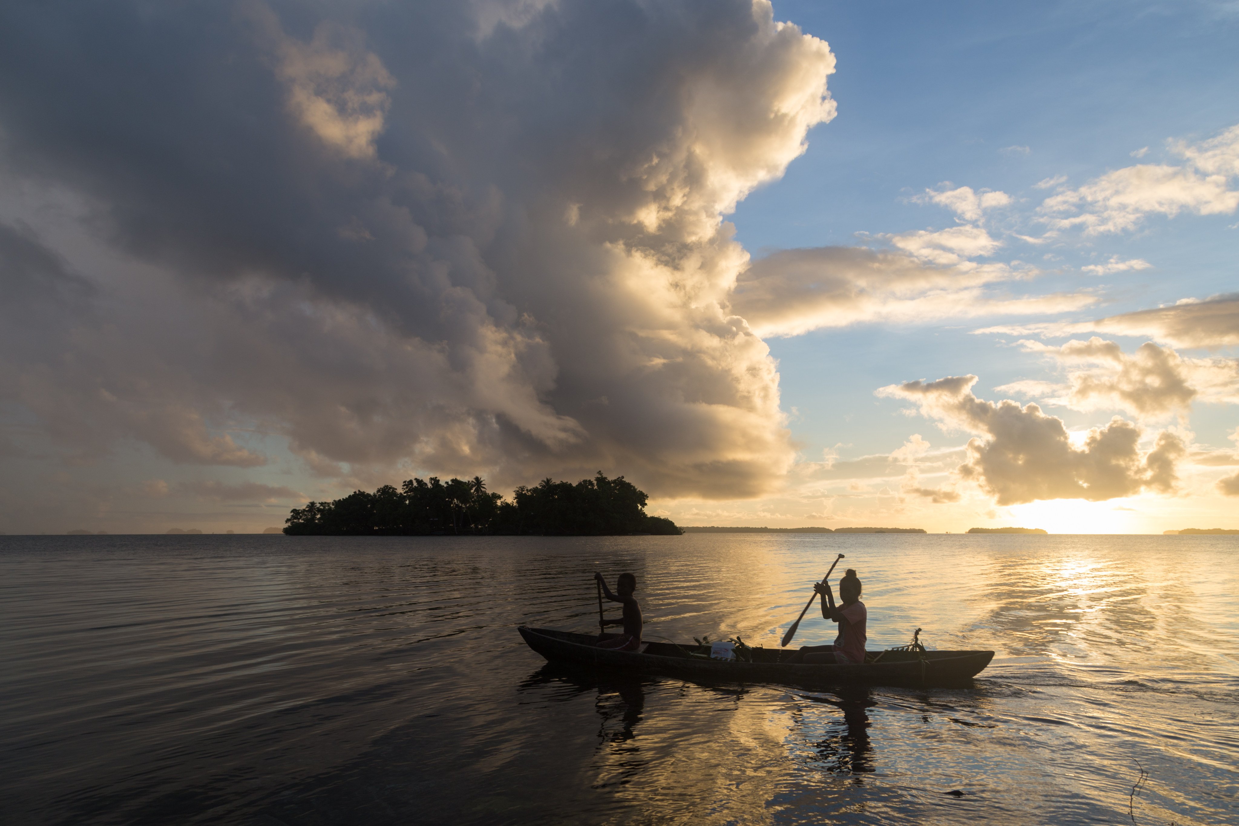 Children take a canoe to school in Solomon Islands. Pacific island nations have stepped up their marine conservation plans. Photo: Shutterstock