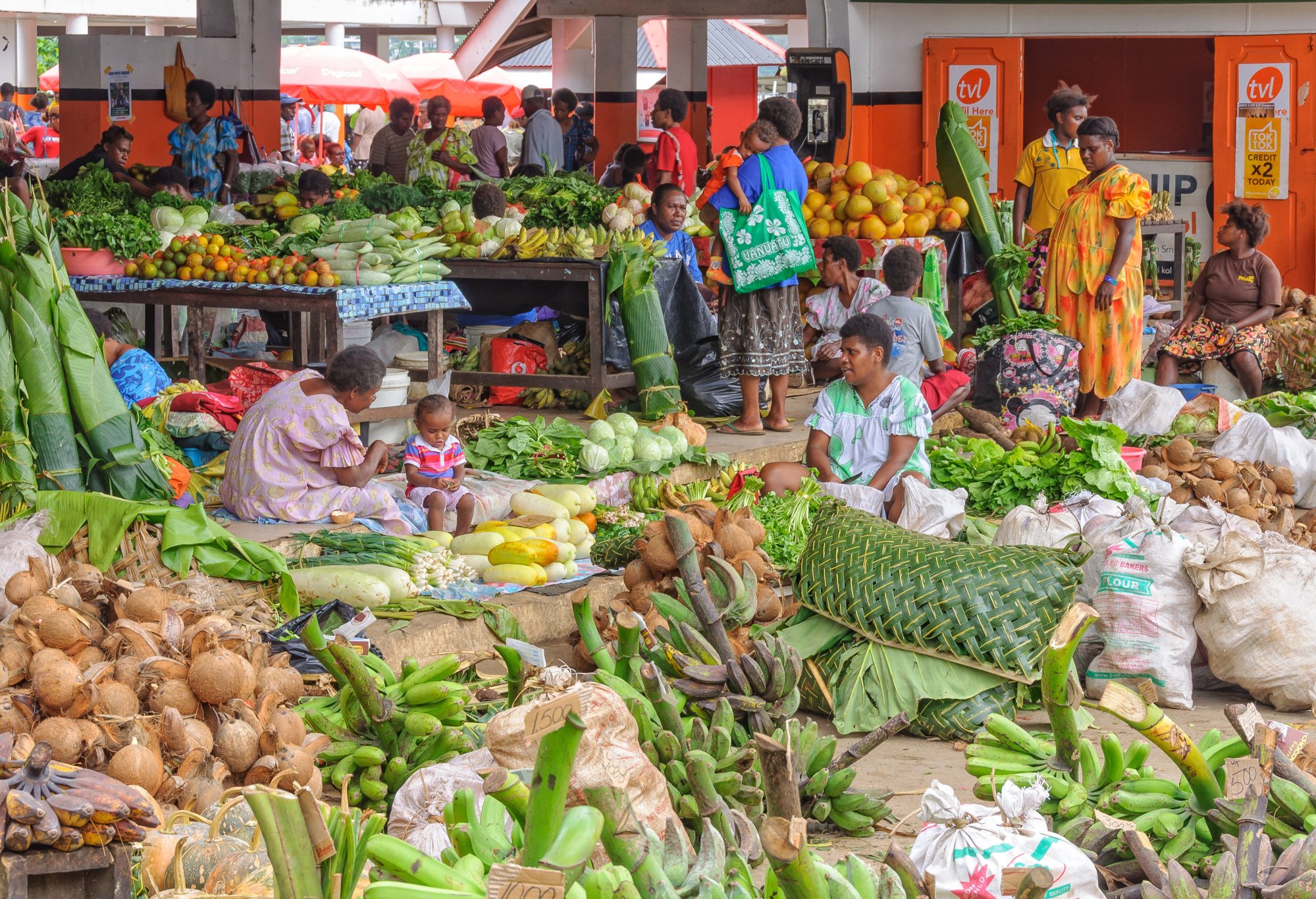 People gather at a market in Port Vila in Vanuatu. Pacific island economies such as Vanuatu are vulnerable to the effects of climate change. Photo: Shutterstock People gather at a market in Port Vila in Vanuatu. Pacific island economies such as Vanuatu are vulnerable to the effects of climate change. Photo: Shutterstock