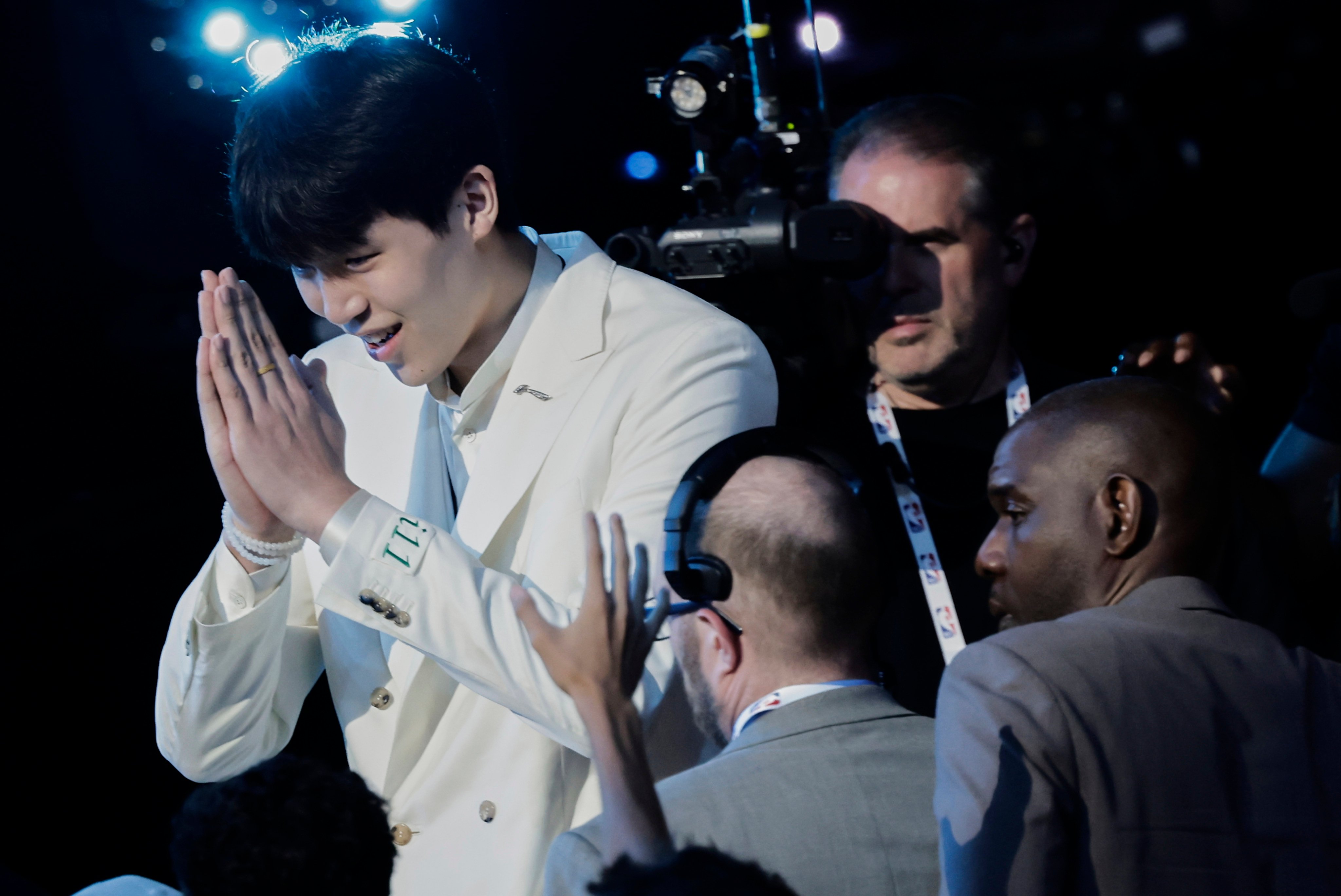 Yang Hansen reacts after being selected 16th by the Memphis Grizzlies in the first round of the NBA draft. Photo: AP