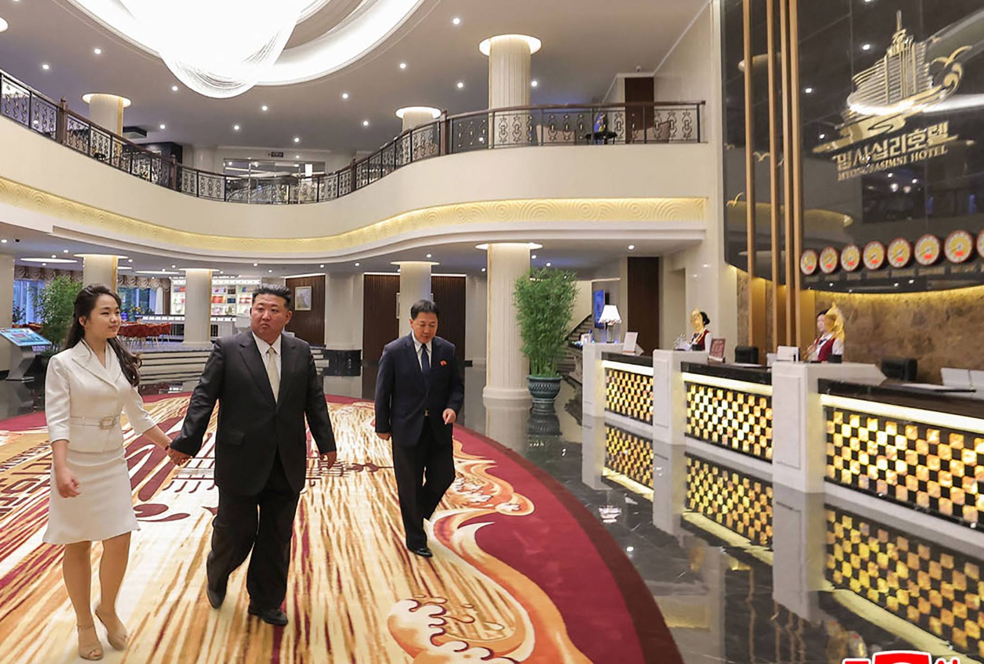 Kim (centre) walks with his daughter as they visit the Wonsan-Kalma coastal tourist area on Tuesday. Photo: KCNA/AFP Kim (centre) walks with his daughter as they visit the Wonsan-Kalma coastal tourist area on Tuesday. Photo: KCNA/AFP