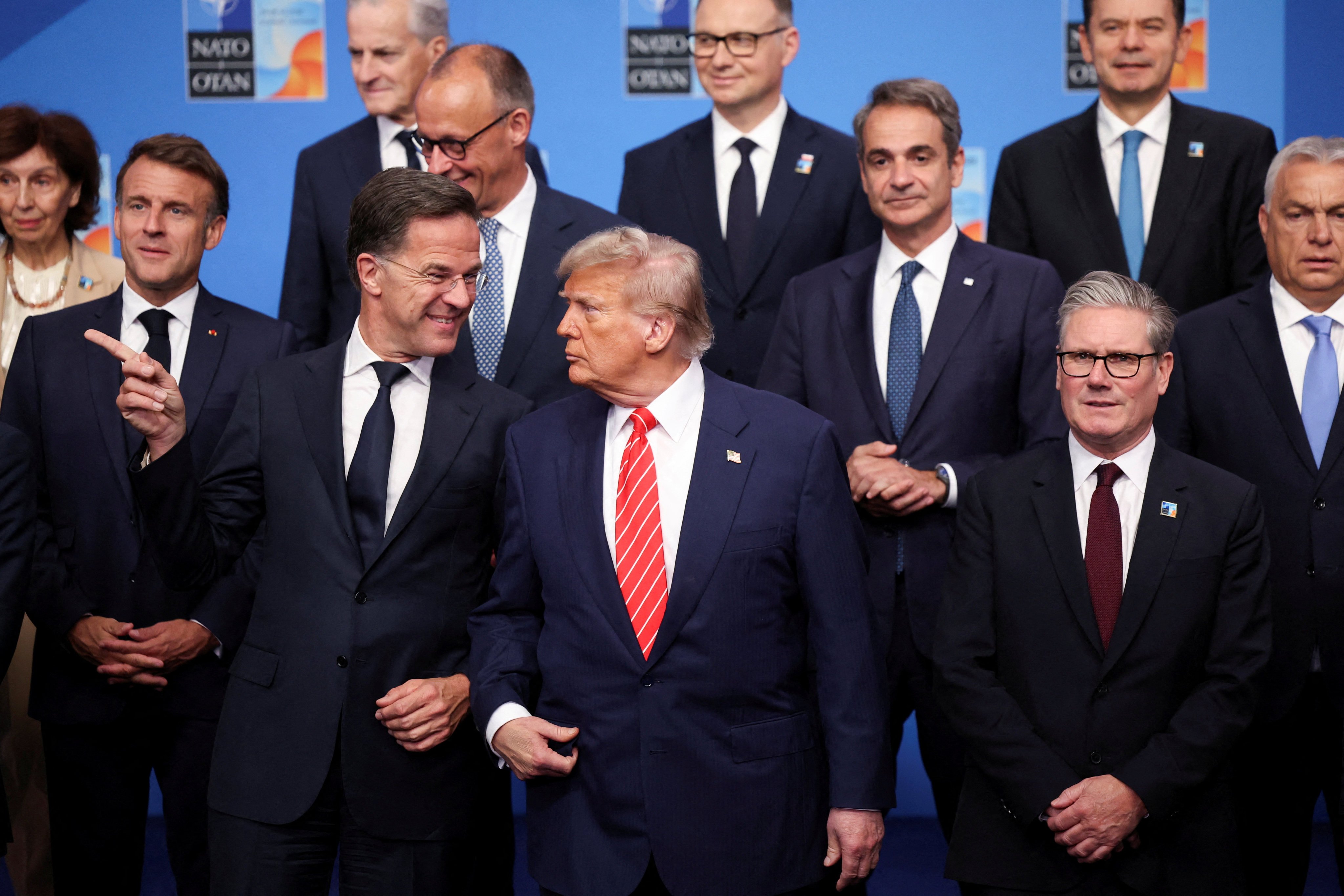 Nato Secretary General Mark Rutte, US President Donald Trump and other leaders pose for a family photo at the Nato  summit. Photo: Reuters