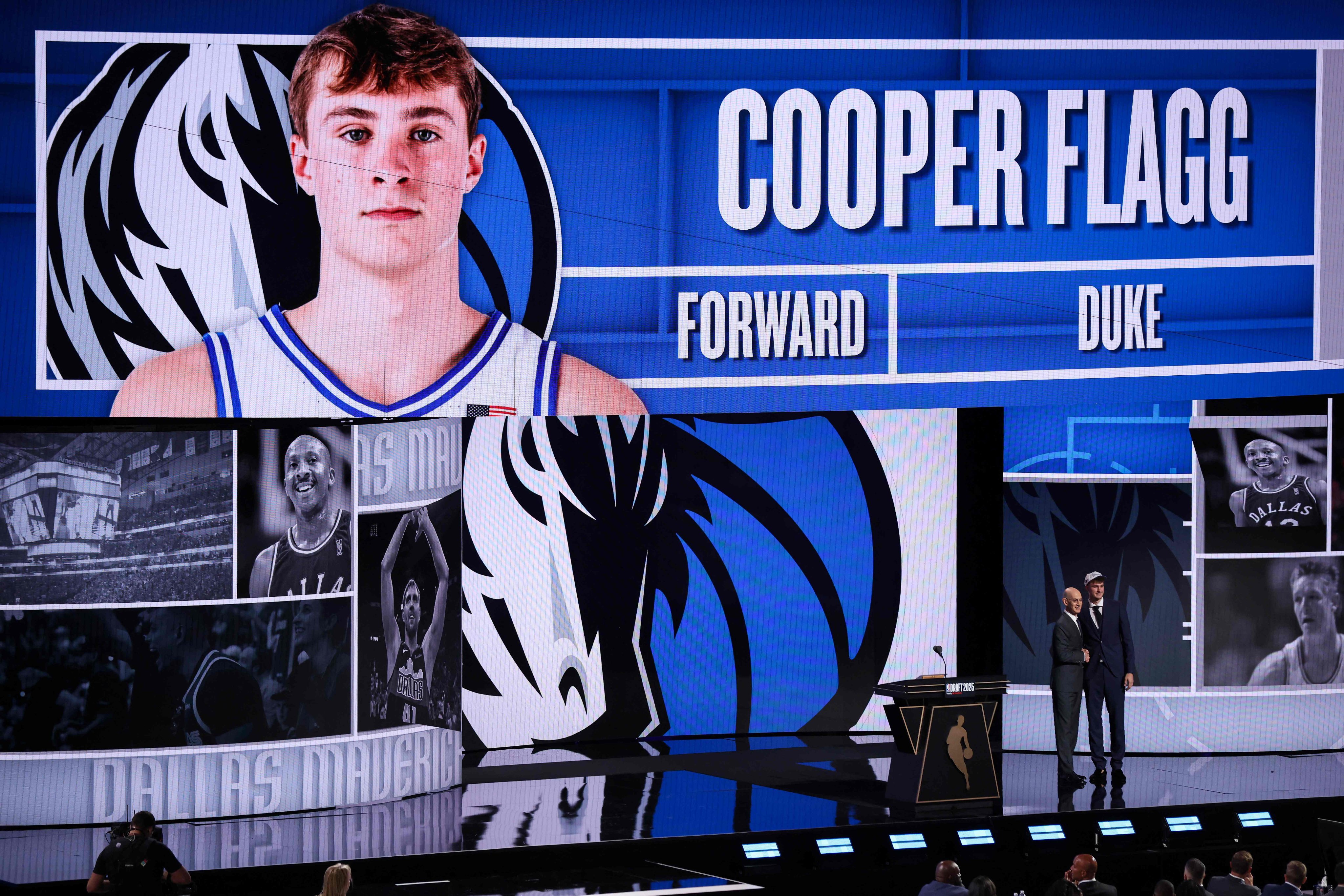 Cooper Flagg (right) shakes hands with NBA commissioner Adam Silver after being drafted first overall by the Dallas Mavericks. Photo: AFP