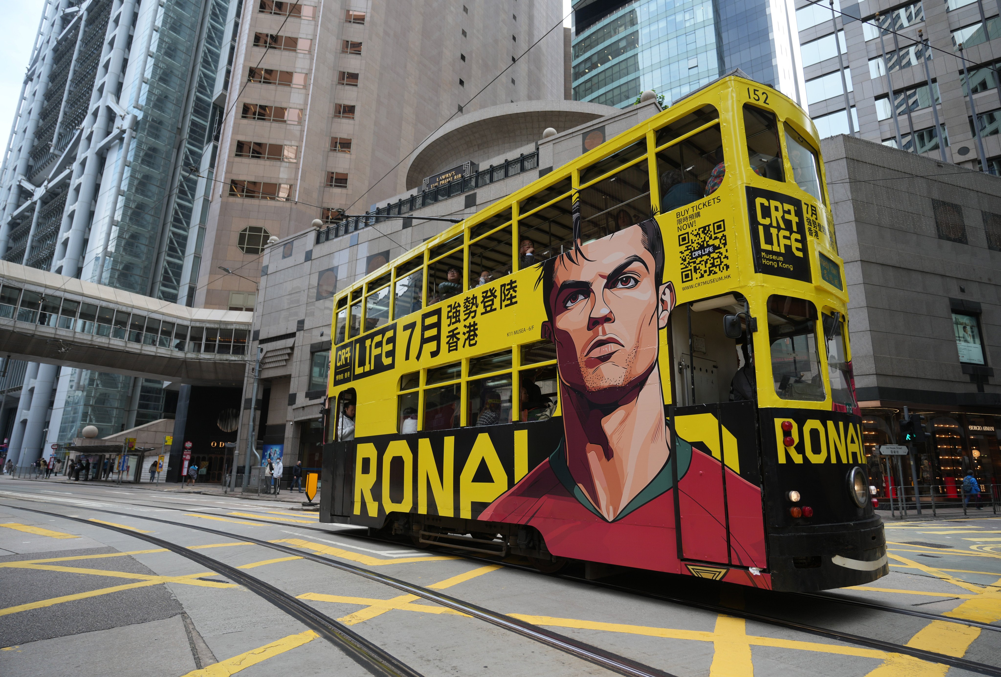 A tram advertising Cristiano Ronaldo’s museum passes through Hong Kong. Photo: Sam Tsang