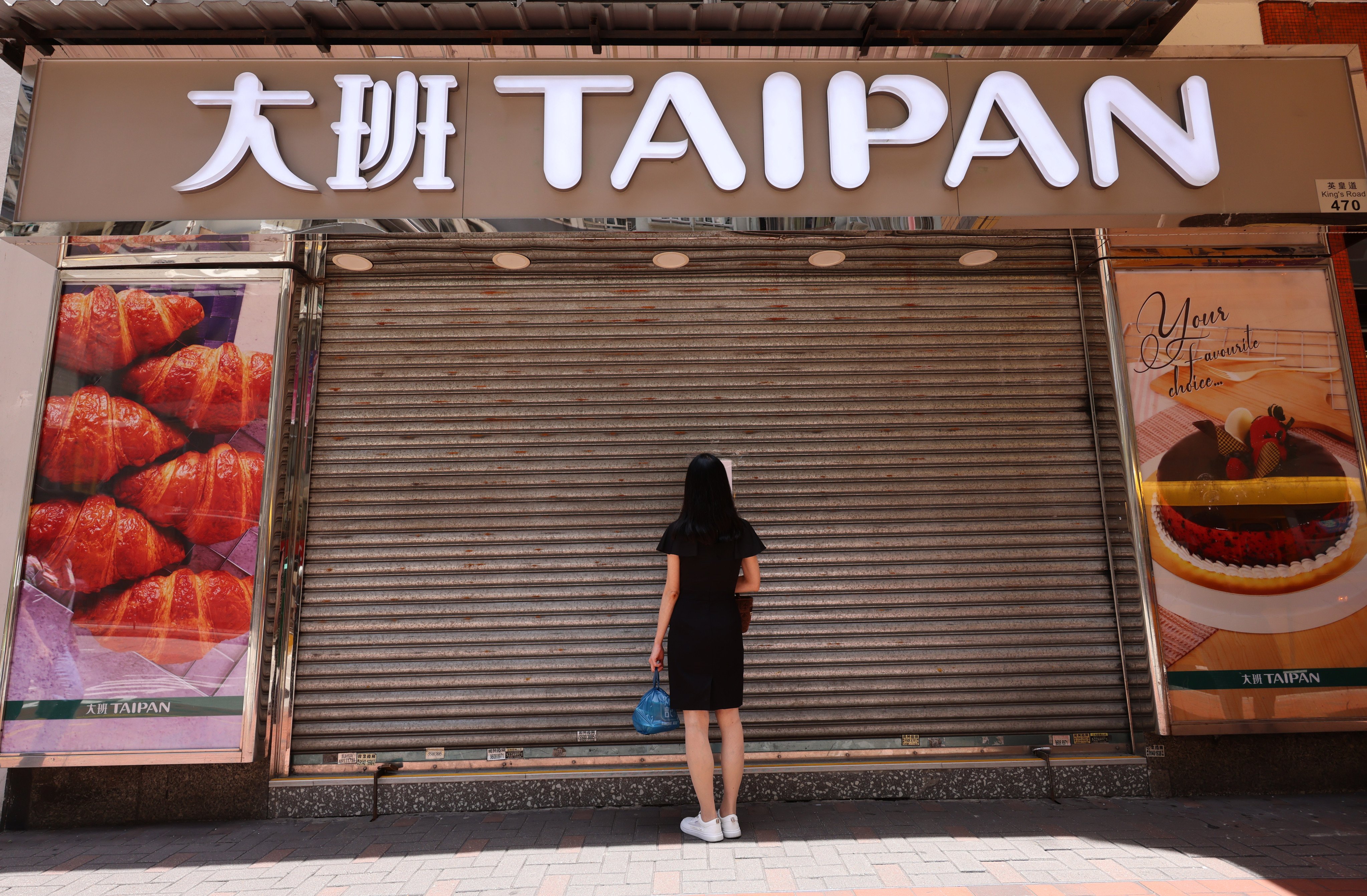 A notice is posted at Taipan Bread & Cakes location in North Point, announcing the company’s closure with immediate effect. Photo: SCMP/Jelly Tse