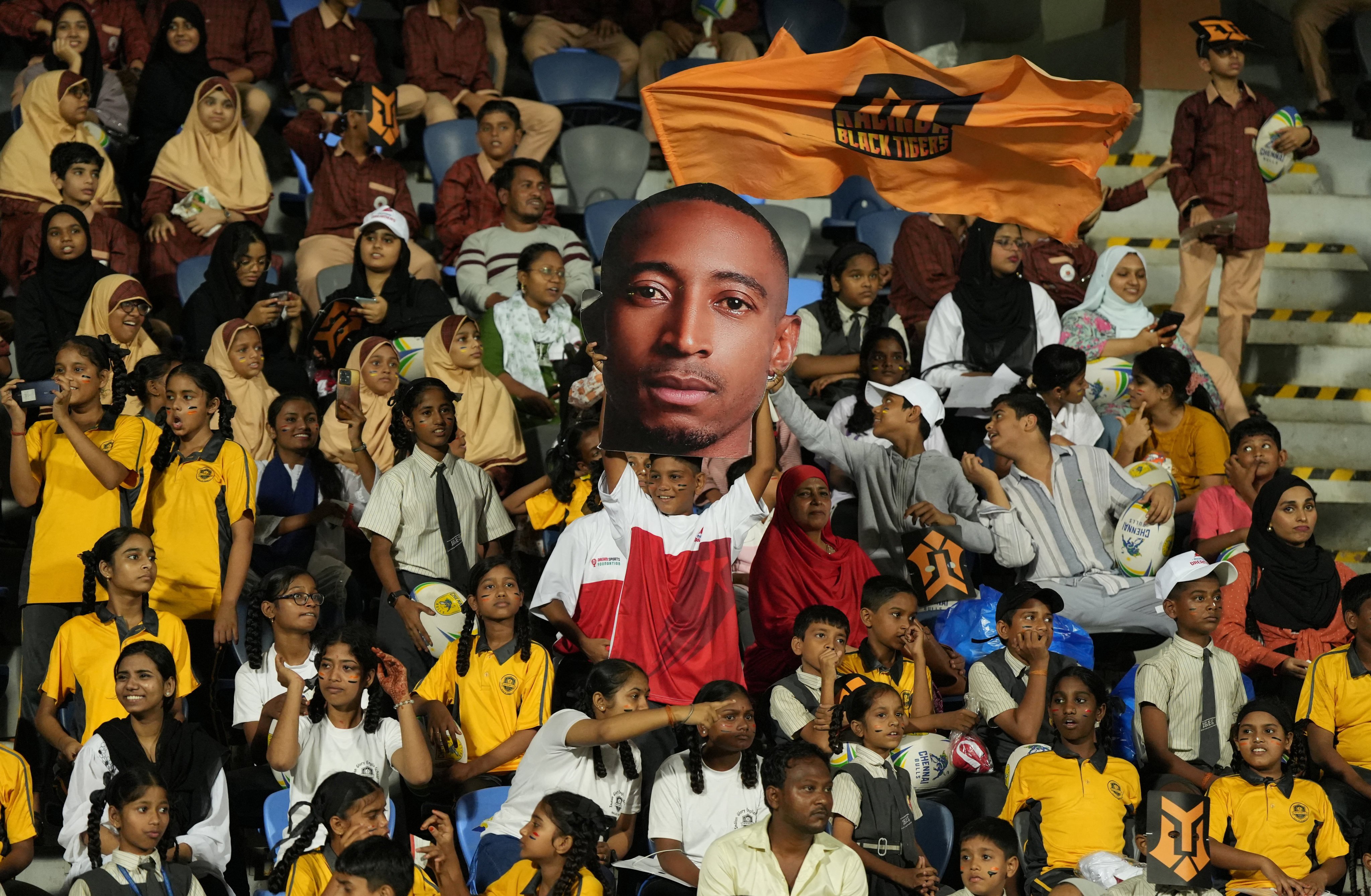 A fan holds a cutout of Kalinga Black Tigers’ Perry Baker during their match against Mumbai Dreamers’ at the Rugby Premier League in Mumbai, India on Tuesday. Photo: Reuters