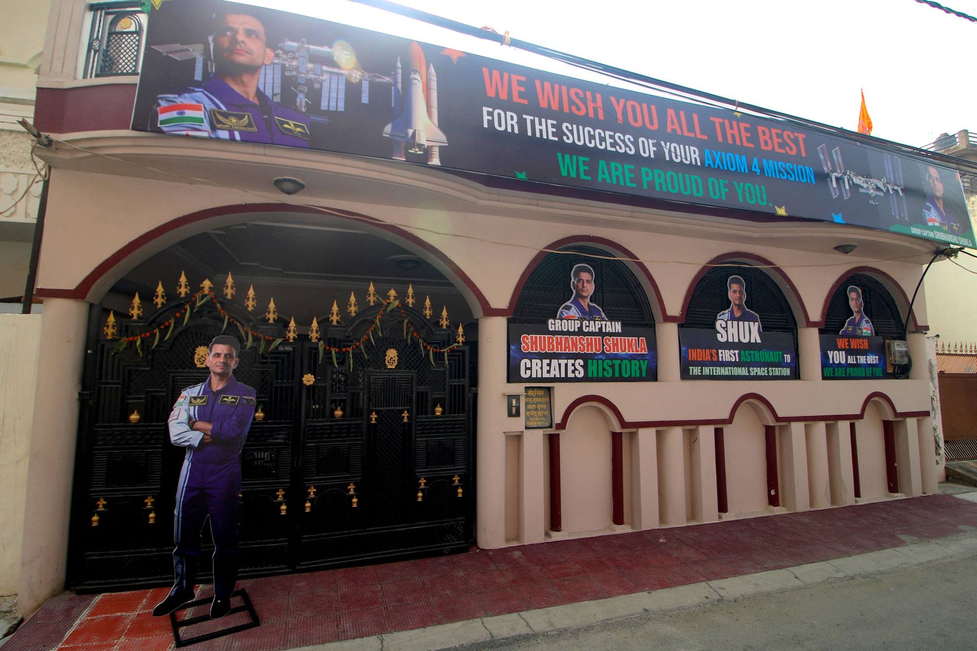 A banner offering best wishes to astronaut Shubhanshu Shukla is displayed outside his residence in Lucknow on June 9. Photo: AFP A banner offering best wishes to astronaut Shubhanshu Shukla is displayed outside his residence in Lucknow on June 9. Photo: AFP