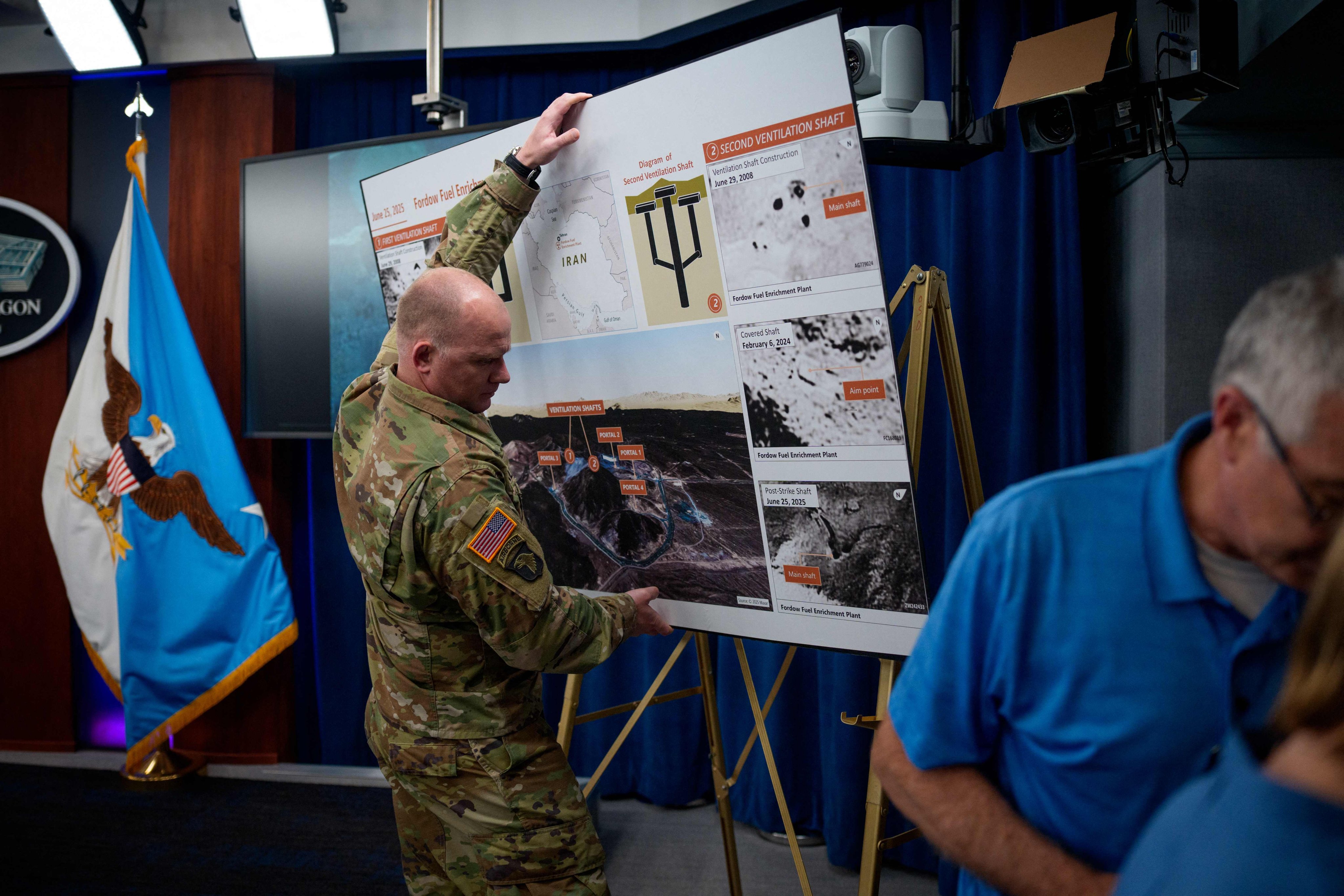 A poster showing US assessments of damage to Iran’s Fordow nuclear facility is removed following a Pentagon news conference on Thursday. Photo: AFP