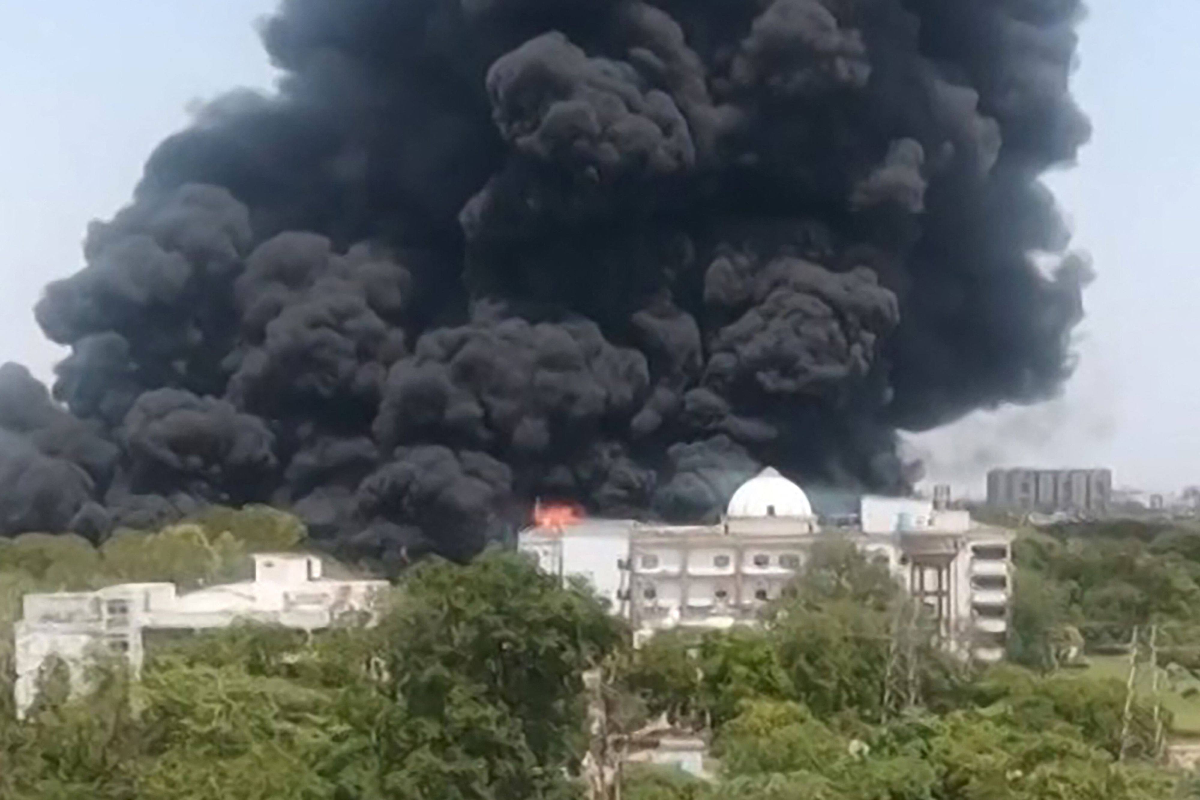A screengrab from video footage shows smoke rising from a residential area after Air India flight 171 crashed in Ahmedabad on June 12. Photo: AFP