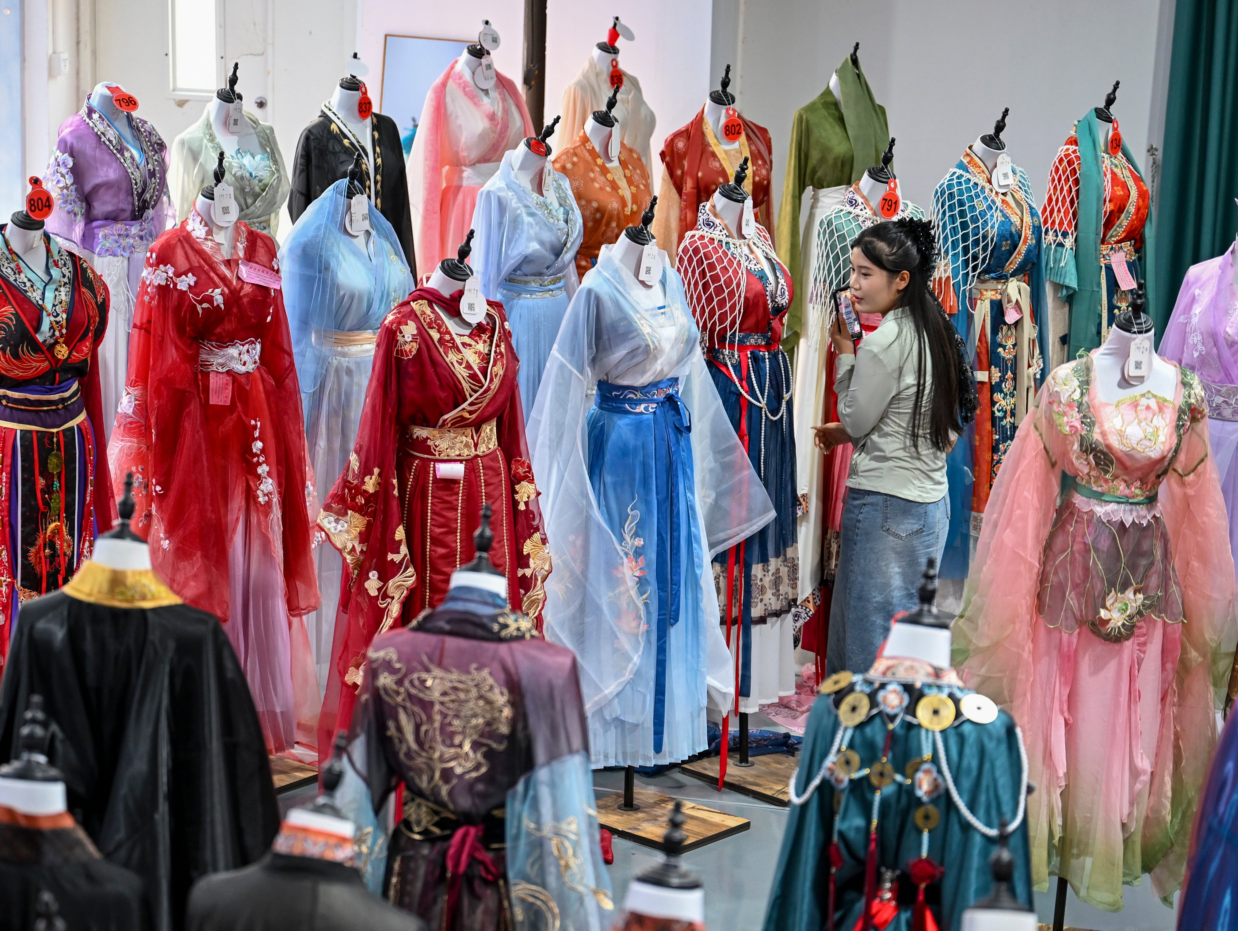 A woman promotes hanfu during a live stream at a hanfu base. Photo: Xinhua
