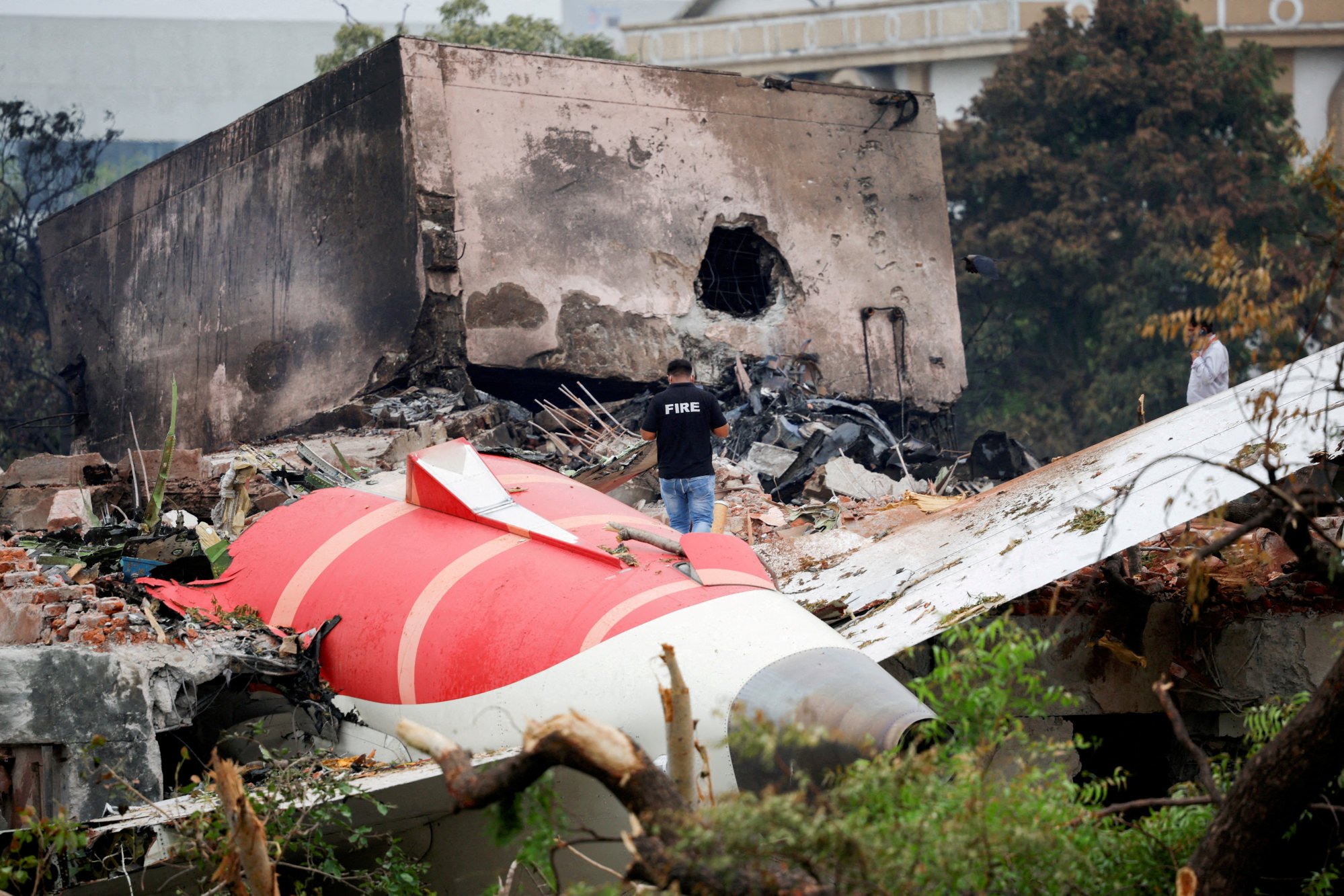A firefighter stands next to the crashed Air India Boeing 787-8 Dreamliner aircraft in Ahmedabad, India, on June 13. The crash has severely affected Air India’s reputation and operations. Photo: Reuters A firefighter stands next to the crashed Air India Boeing 787-8 Dreamliner aircraft in Ahmedabad, India, on June 13. The crash has severely affected Air India’s reputation and operations. Photo: Reuters
