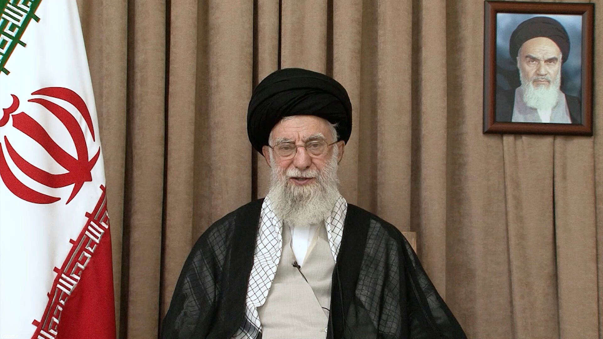 Iranian Supreme leader Ayatollah Ali Khamenei in a televised speech, under a portrait of the late revolutionary founder Ayatollah Khomeini. Photo: Office of the Iranian Supreme Leader via AP