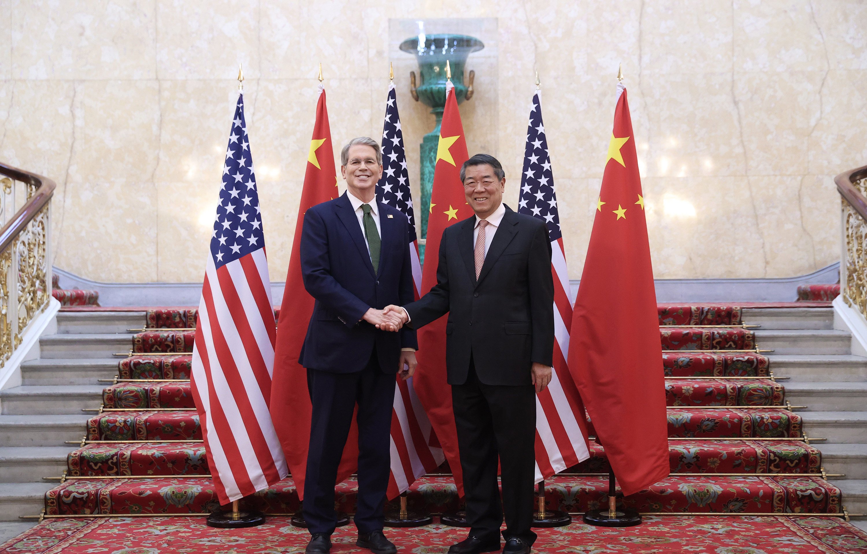 US Treasury Secretary Scott Bessent and Vice-Premier He Lifeng shake hands before the start of the bilateral trade talks  in London on Monday. Photo: Xinhua