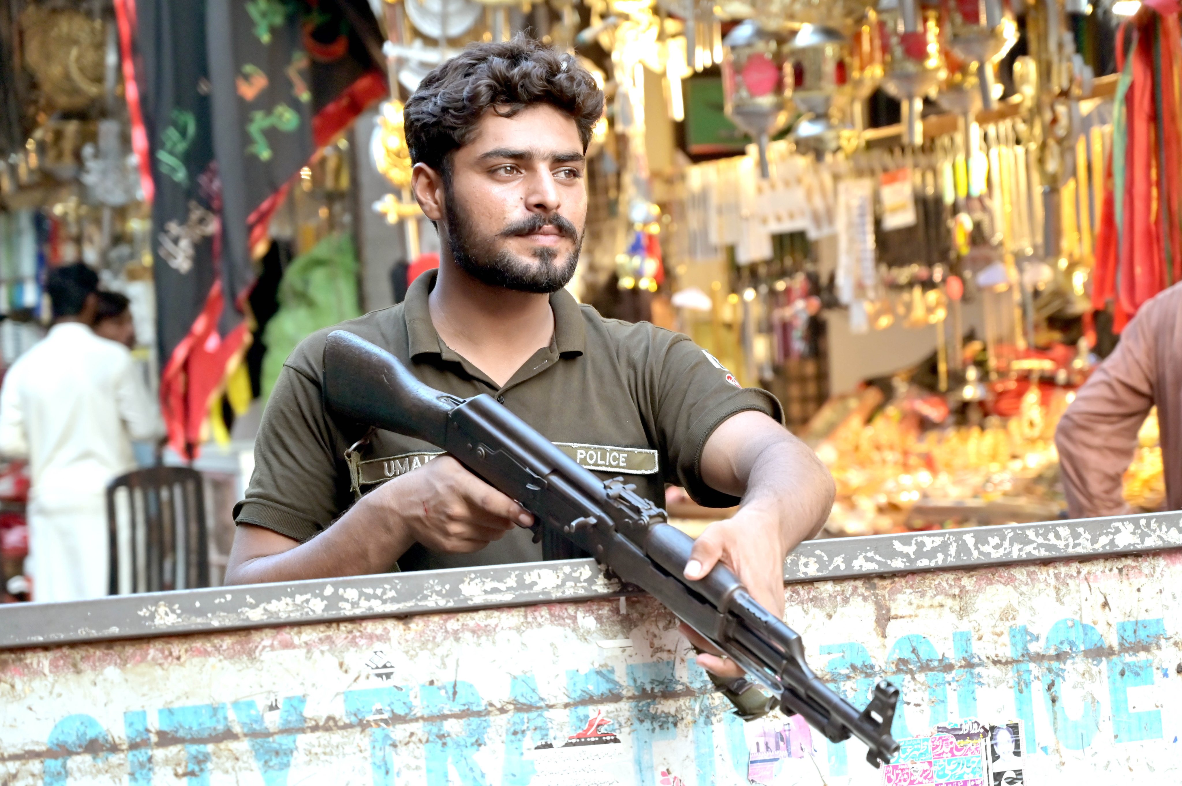 A Pakistani policeman keeps watch on a roadside during, in Lahore, Pakistan, on Friday. Photo: EPA-EFE