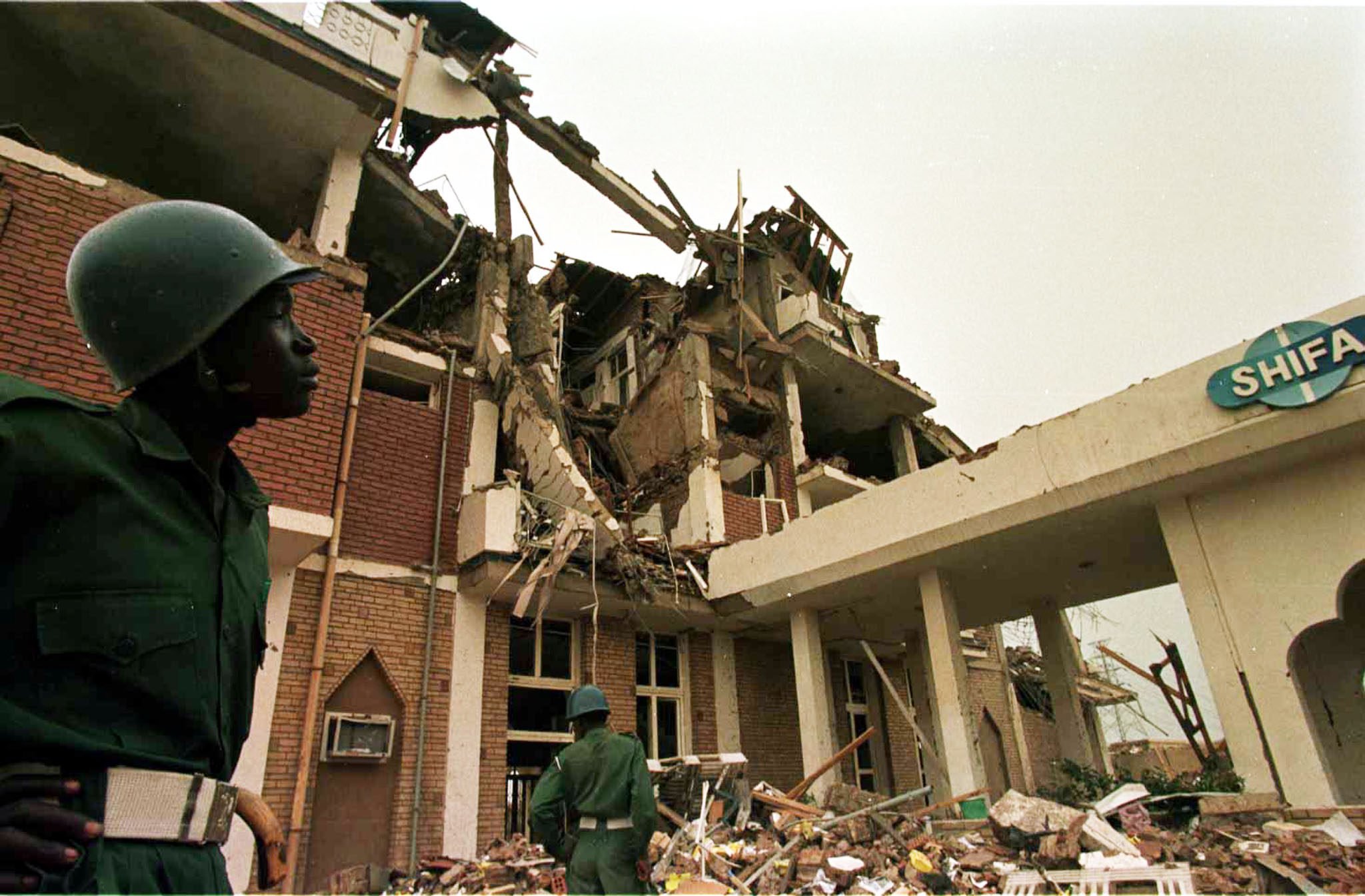 Sudanese soldiers look at the  wreckage of a pharmaceutical factory in the outkirts of Khartoum on August 25, 1998 that was hit by US missiles, following US claims it produced precursors to chemical weapons. Photo: AP