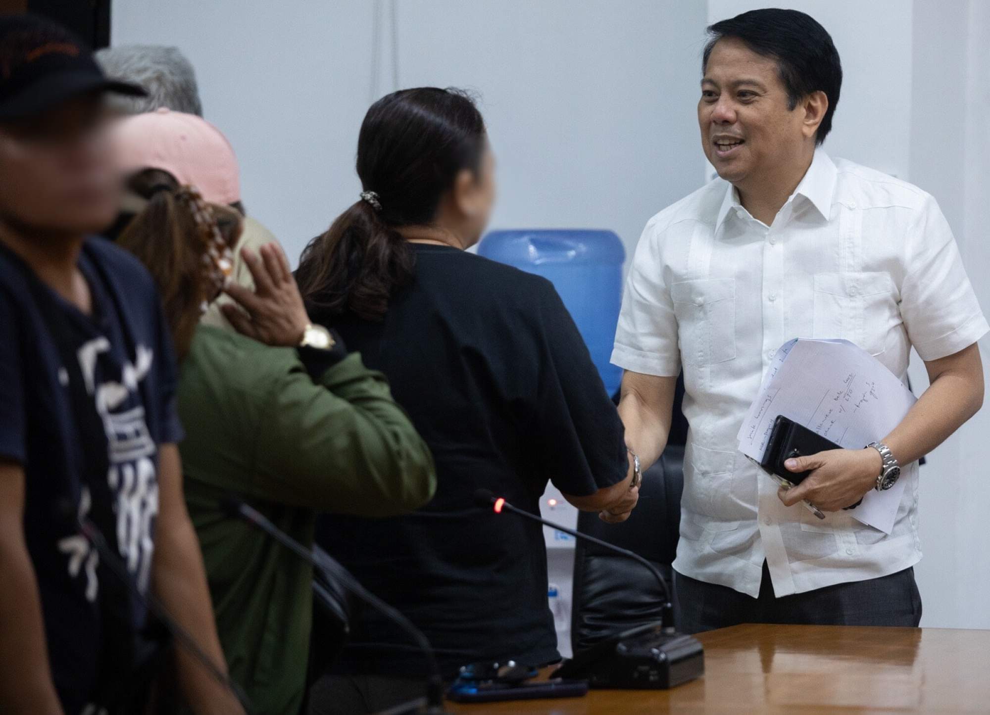 Philippines’ Commission on Human Rights Commissioner Beda Epres (right) meeting victims’ families on June 24. Photo: Sam Beltran