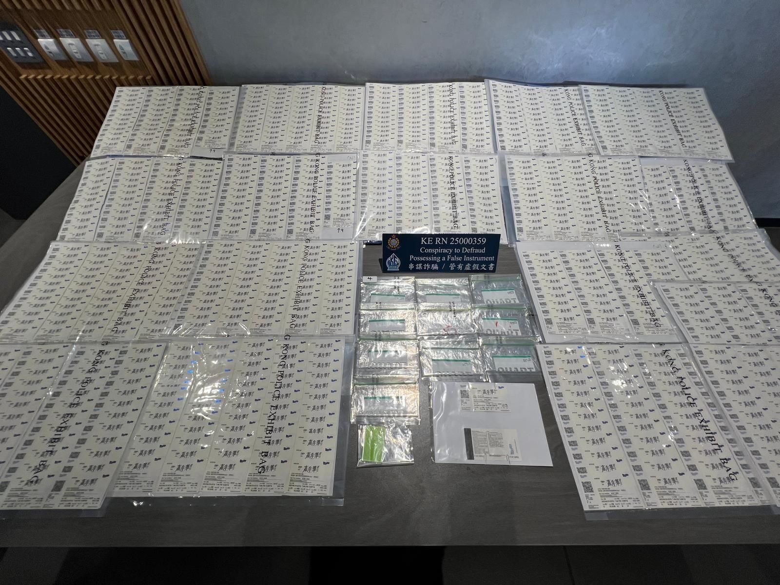 Officers found 1,073 fake concert tickets in a hotel room in To Kwa Wan while two were seized from the suspects. Photo: Handout