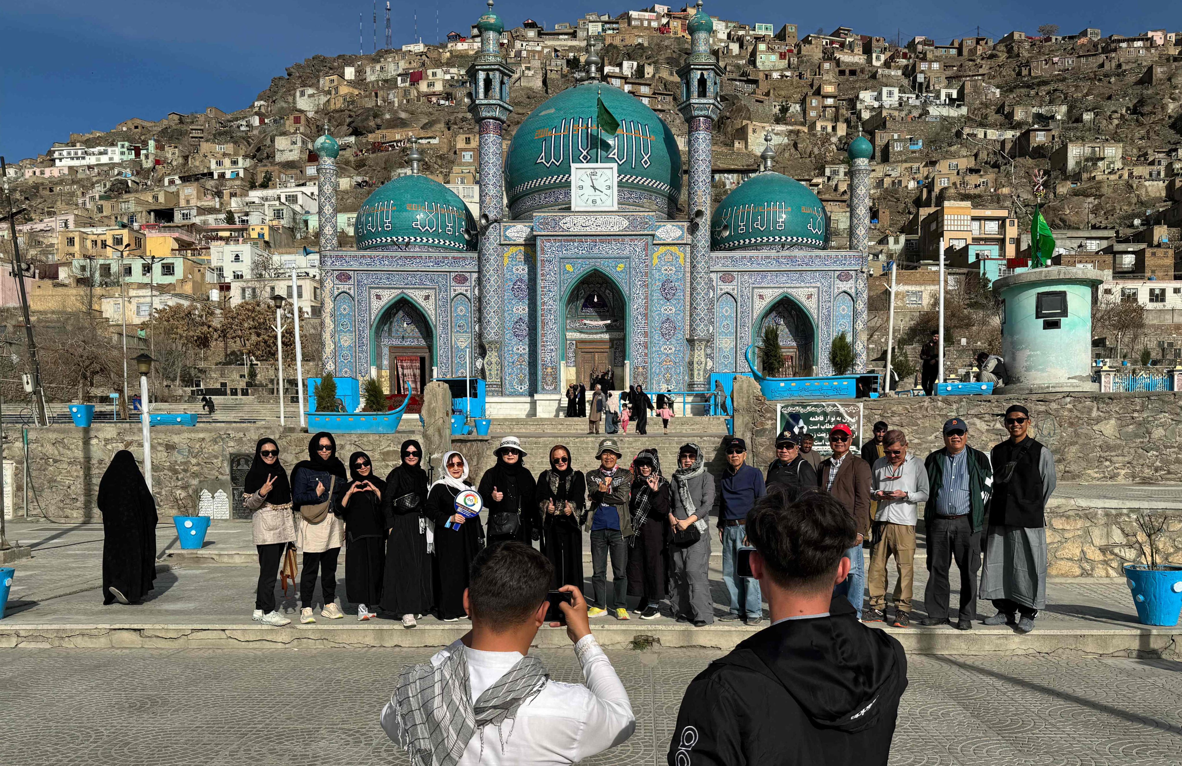 In this picture taken on March 25, 2024, Thai tourists pose for a group picture during their visit to the Kart-e-Sakhi Shrine in Kabul, Afghanistan. Photo: AFP