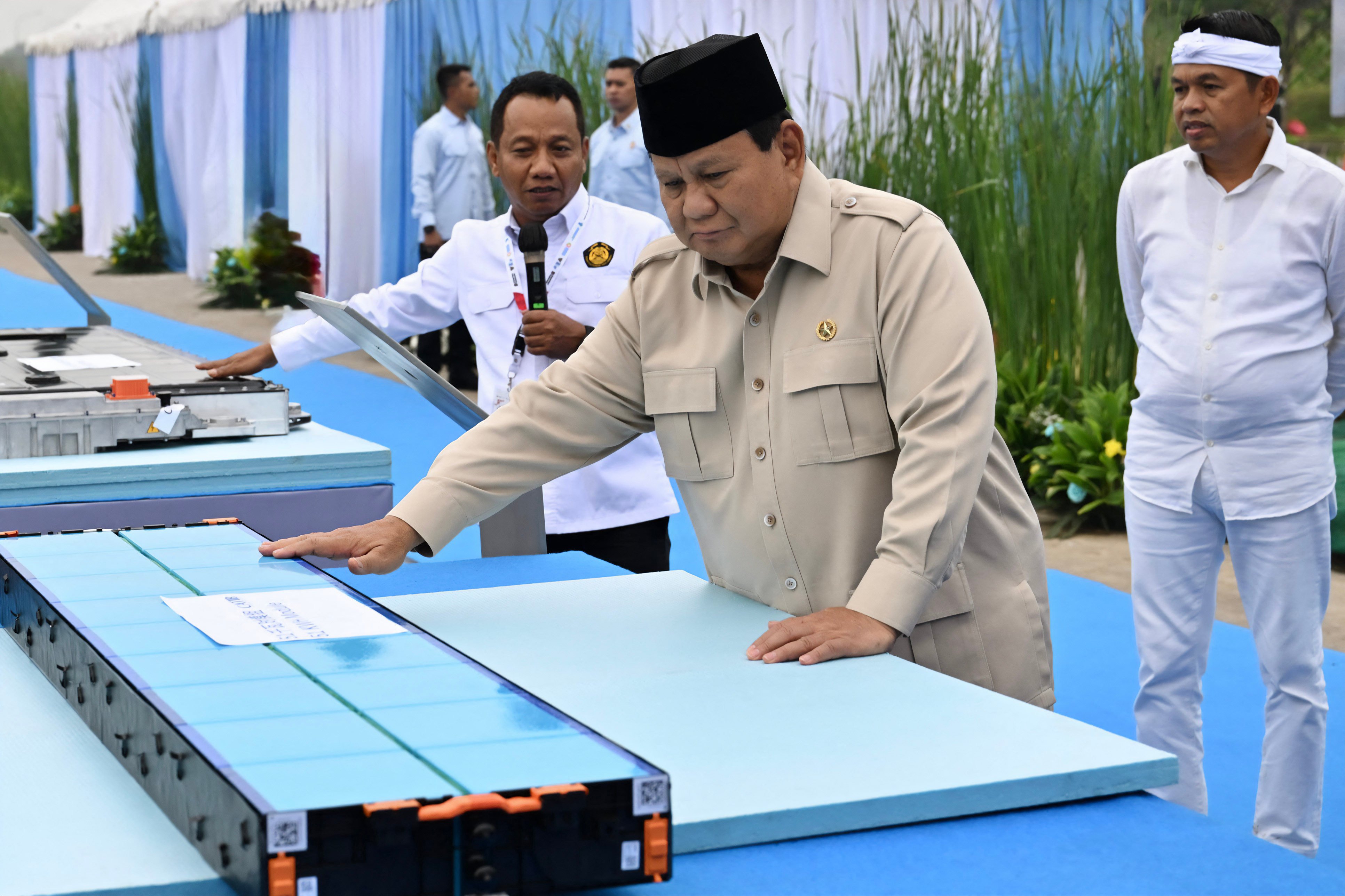 Indonesian President Prabowo Subianto holding one of the EV battery products during the inauguration of Southeast Asia’s largest battery industry project in Karawang, West Java, Indonesia, on Sunday. Photo: AFP
