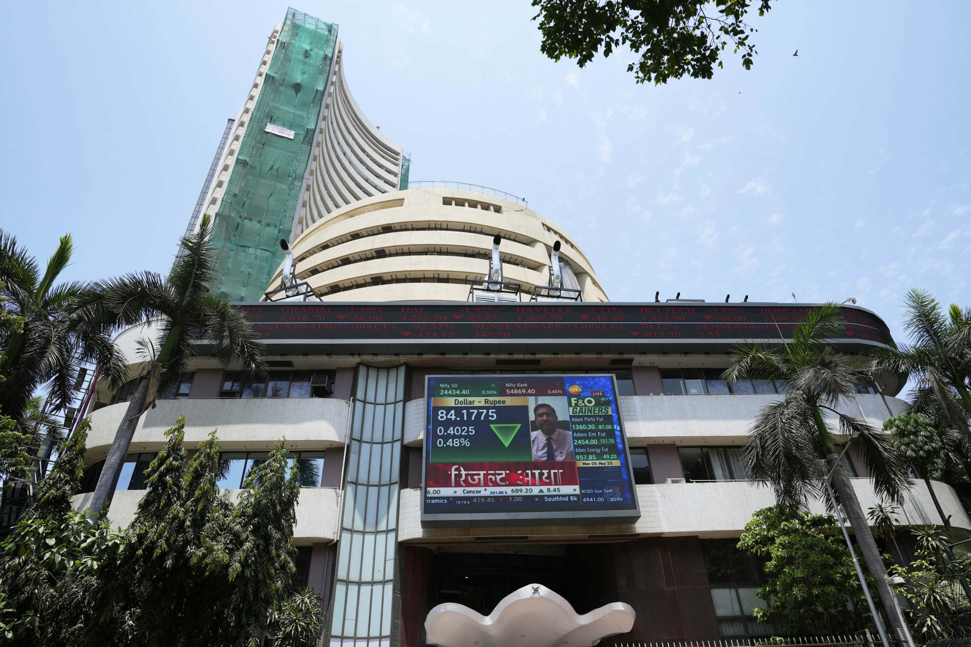 A live screen shows stock market activity at the Bombay Stock Exchange building in Mumbai on May 5. Photo: AP