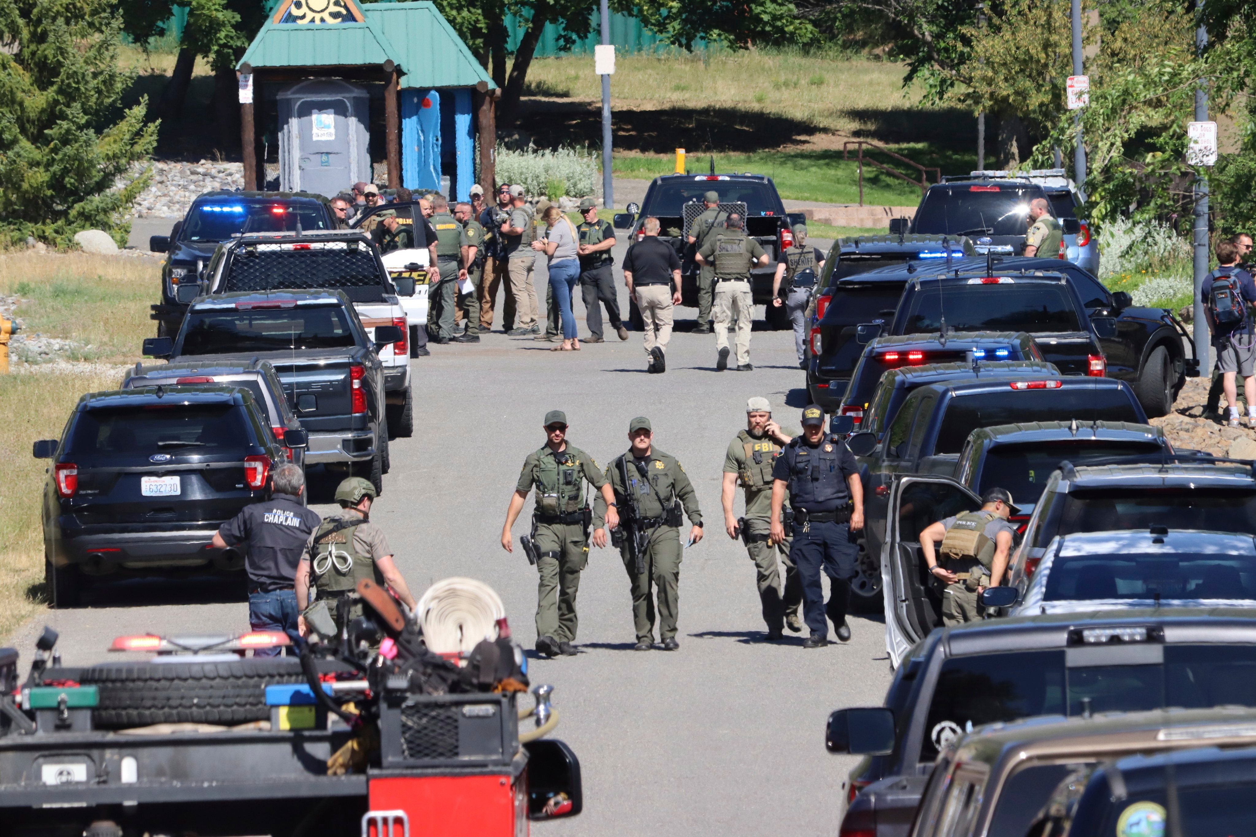 Law enforcement and emergency responders at the scene. Photo: Coeur D’Alene Press via AP