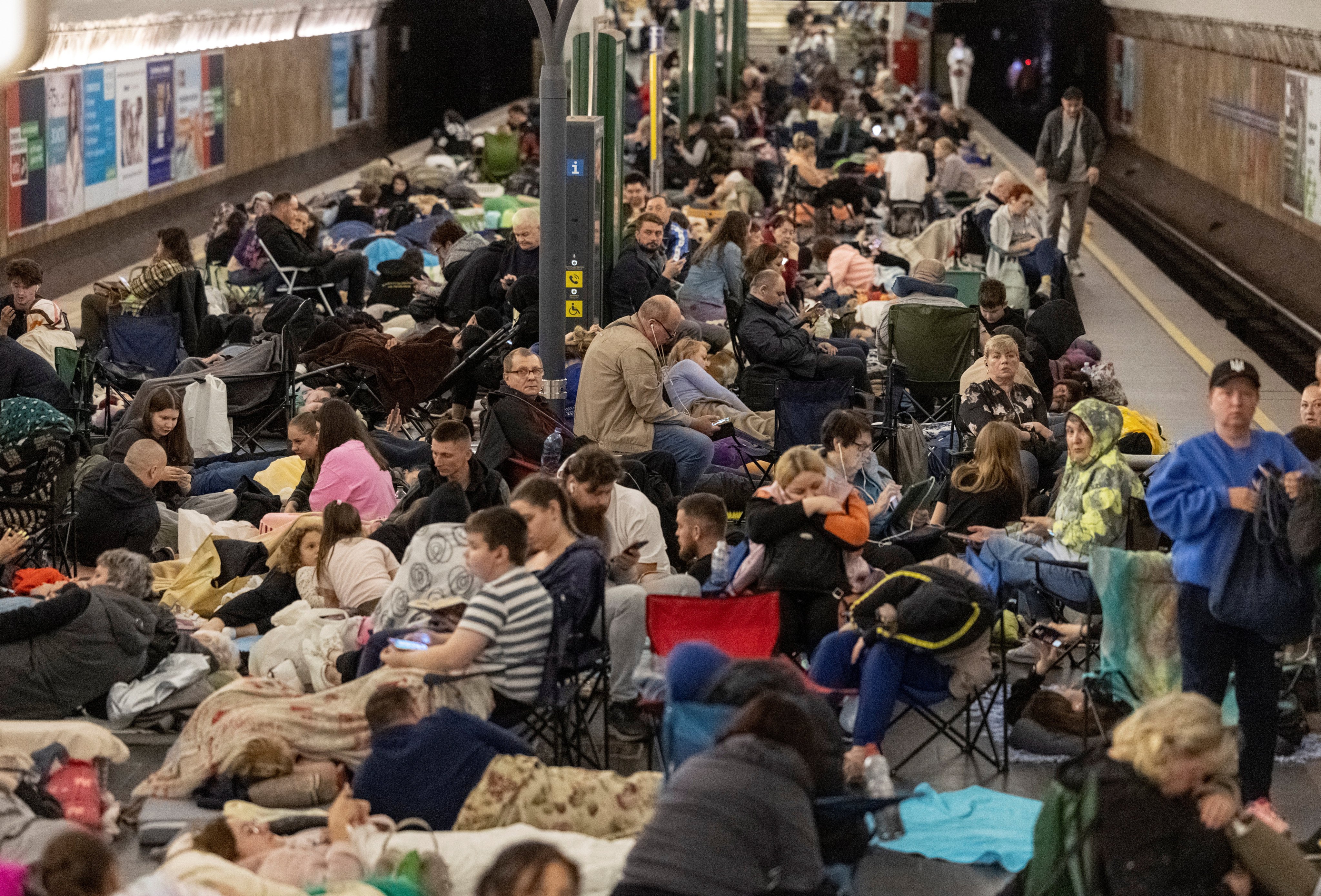 People take shelter inside a metro station in Kyiv, Ukraine. Photo: Reuters
