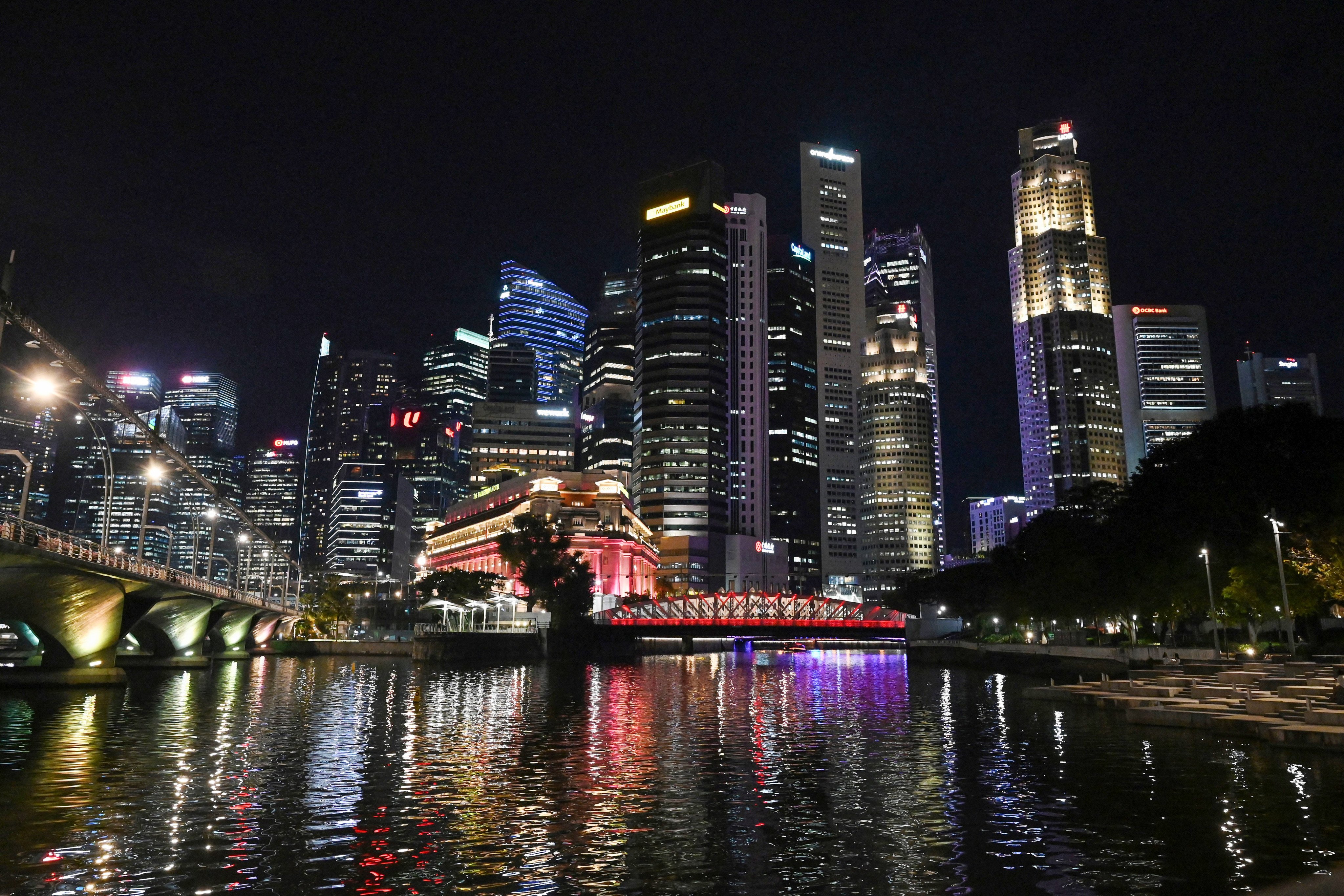 Singapore’s financial business district seen at night. The city state expects to meet around one-third of its power demand from clean electricity imports by 2035. Photo: AFP