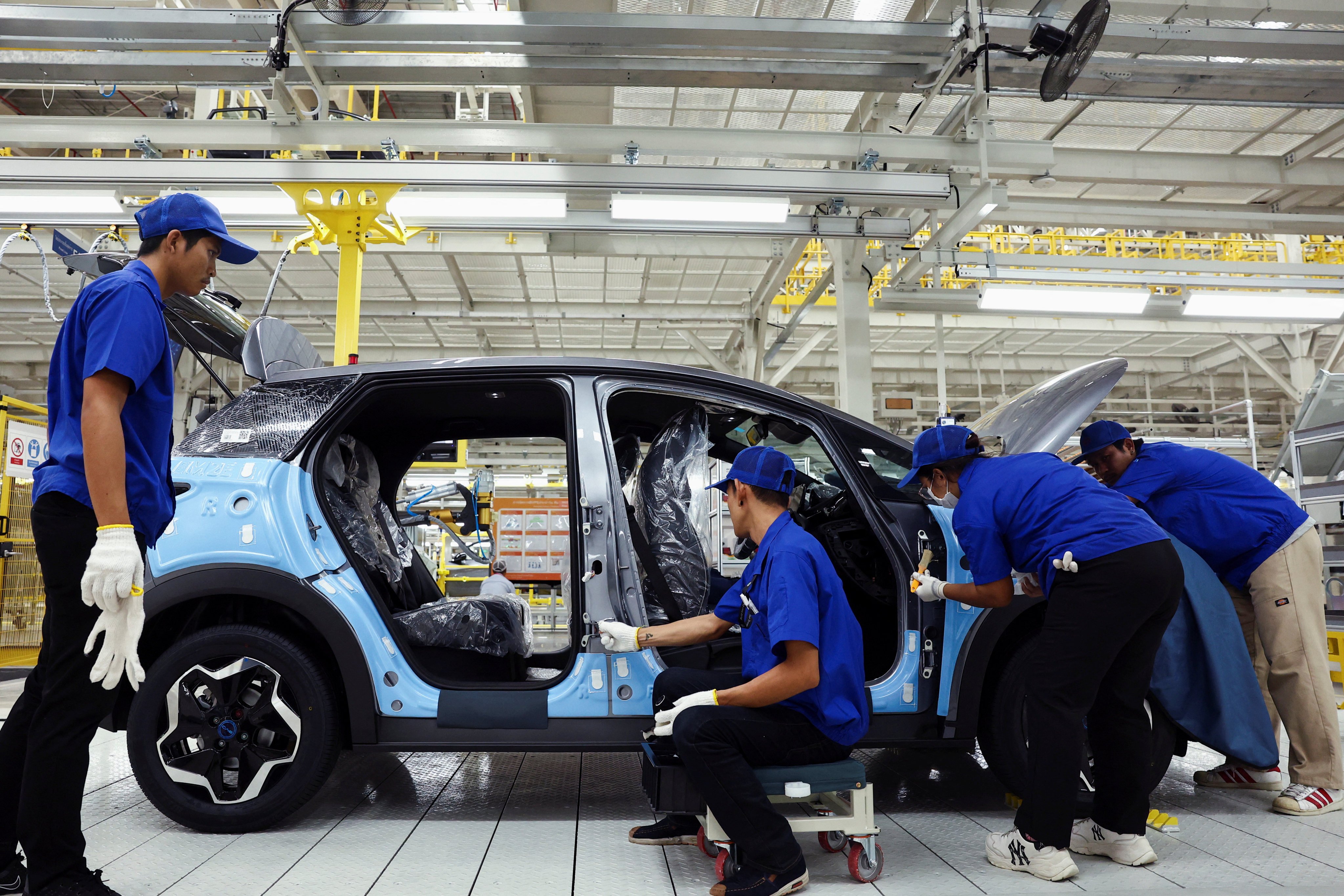 Workers assemble an EV at BYD’s plant in Rayong, Thailand. It is the Chinese firms first EV factory in Southeast Asia. Photo: Reuters