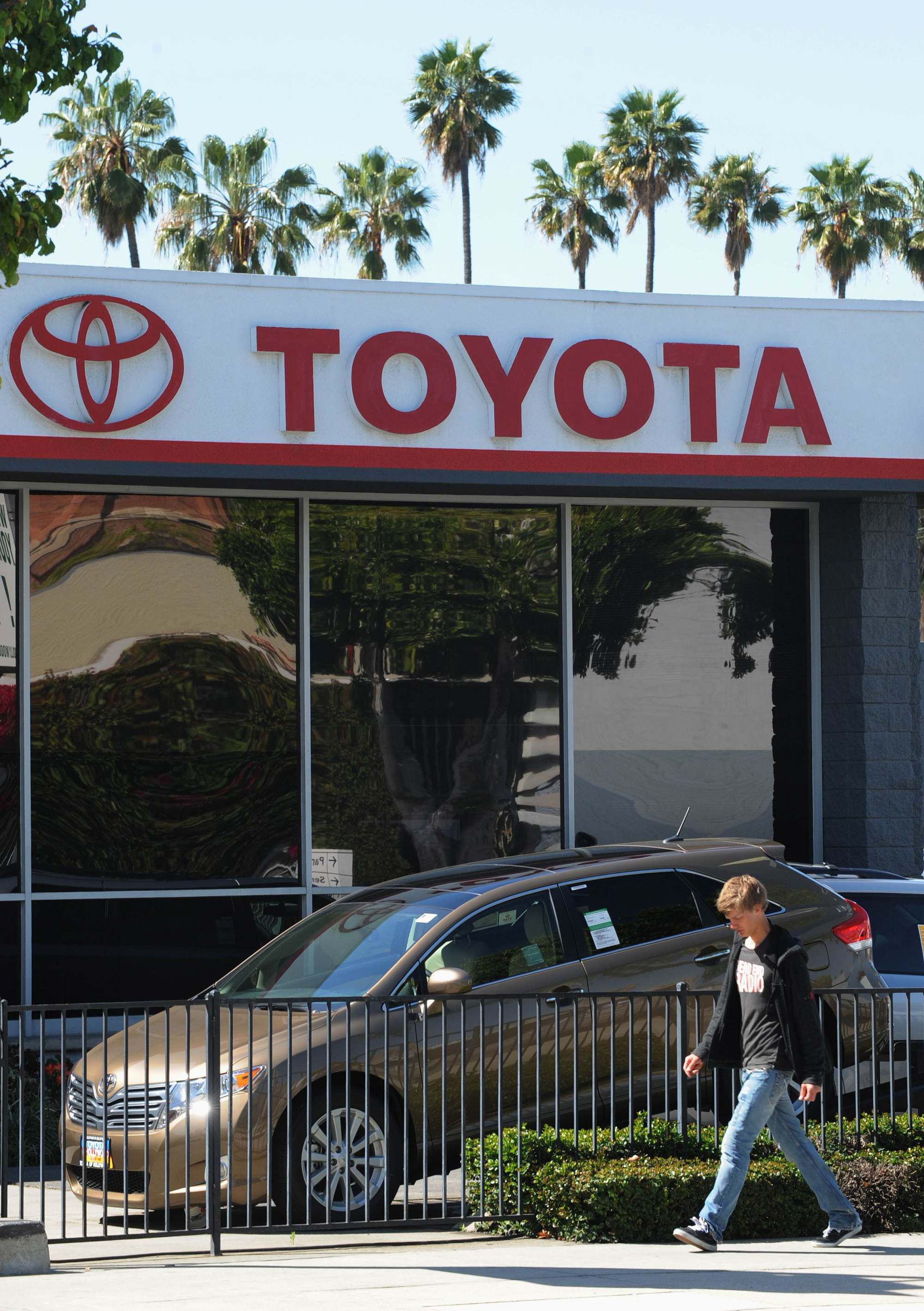 A man walks past Toyota cars for sale at a Toyota dealer in Hollywood. Vehicles account for fully one-third of all Japanese exports. Photo: AFP A man walks past Toyota cars for sale at a Toyota dealer in Hollywood. Vehicles account for fully one-third of all Japanese exports. Photo: AFP