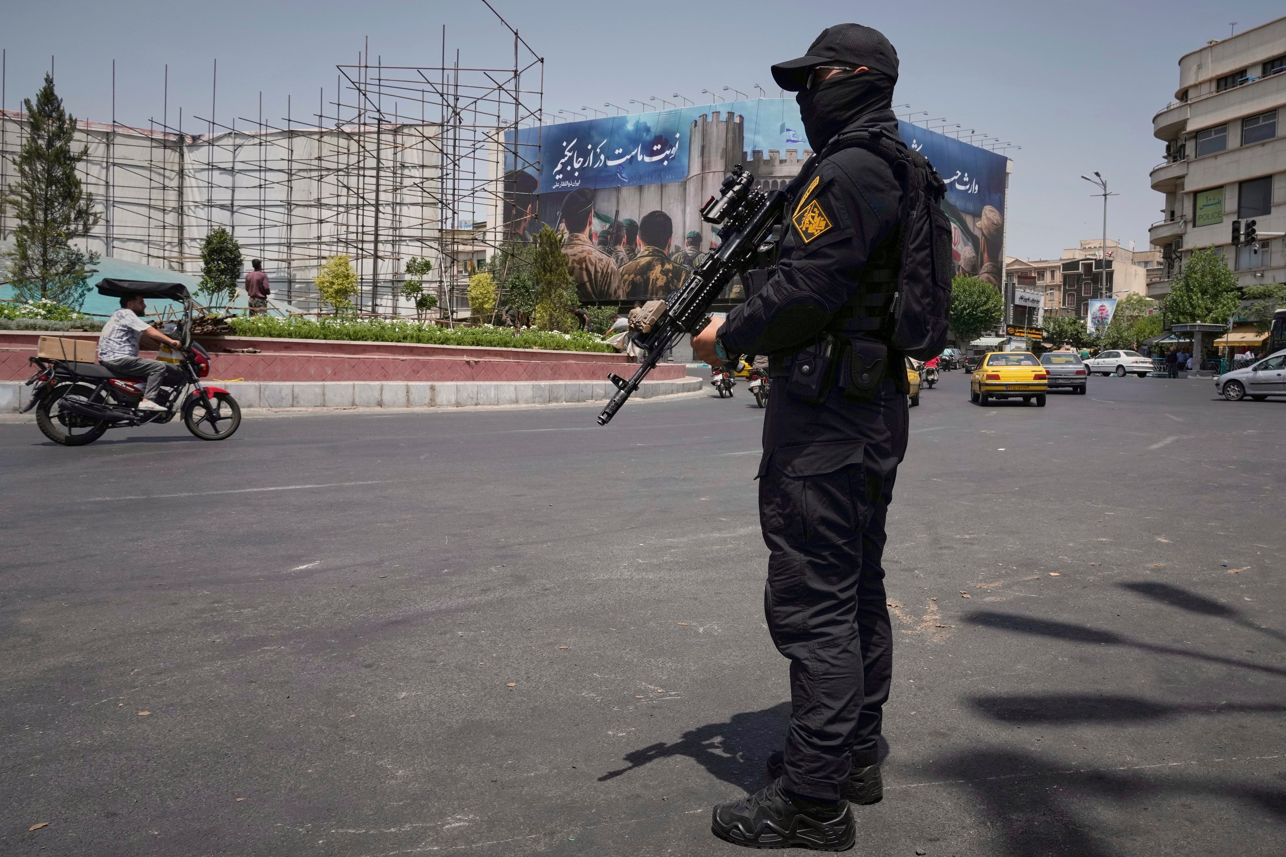 A member of Iran’s Revolutionary Guard stands guard in downtown Tehran. Photo: AP