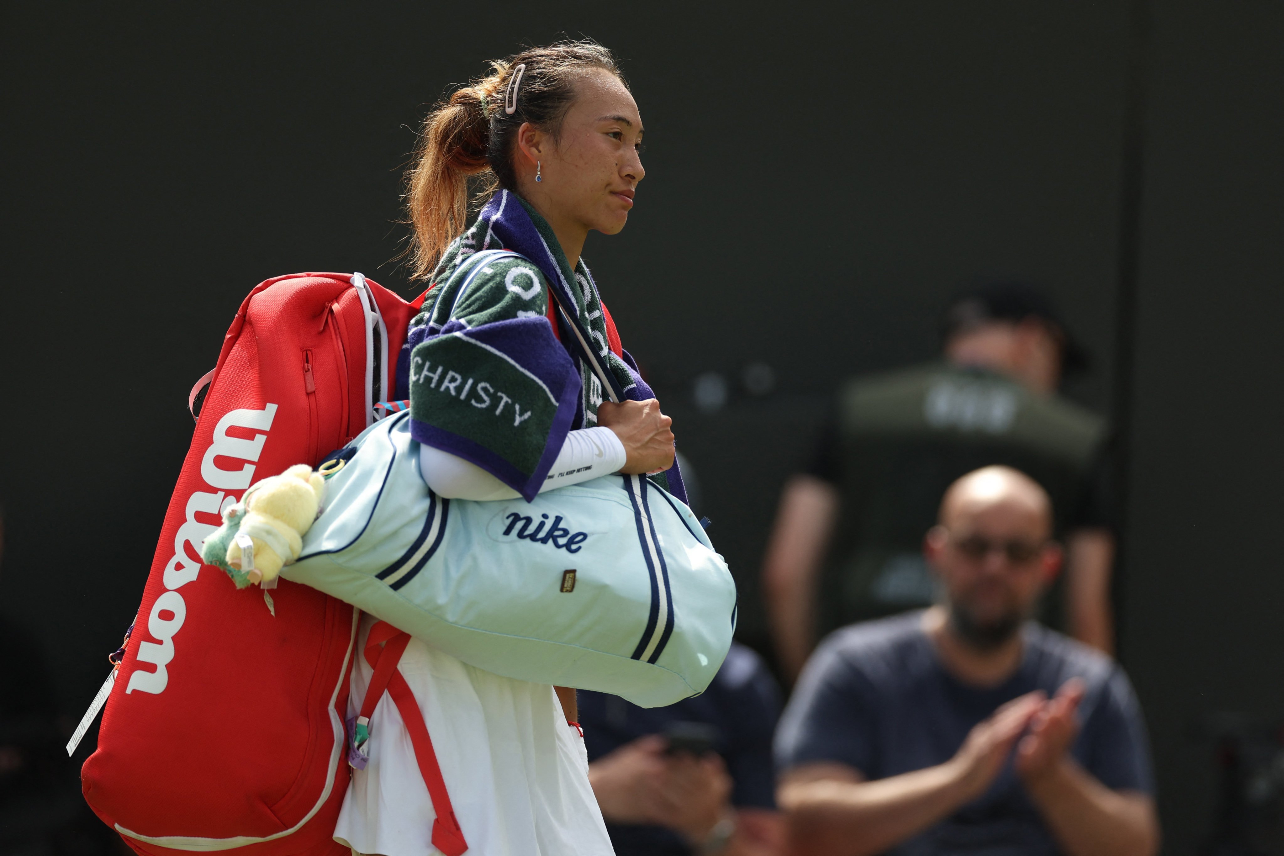China’s Zheng Qinwen walks off the court after losing her first-round match to Katerina Siniakova. Photo: Reuters