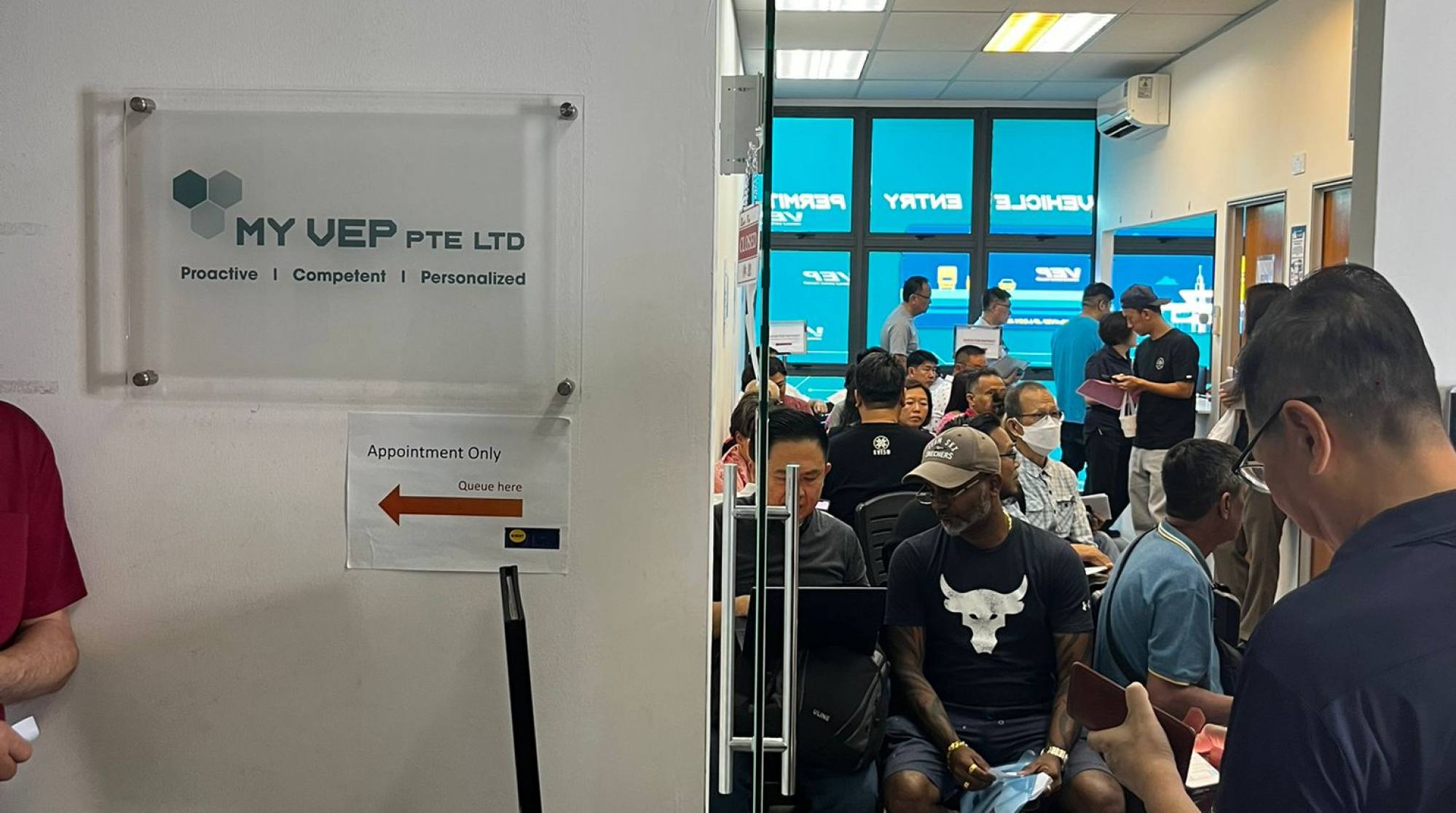 Motorists arrive at the MY VEP Woodlands Centre in Singapore to get their vehicles tagged on Tuesday as Malaysia began enforcement of the Vehicle Entry Permit scheme across the Causeway. Photo: Jean Iau