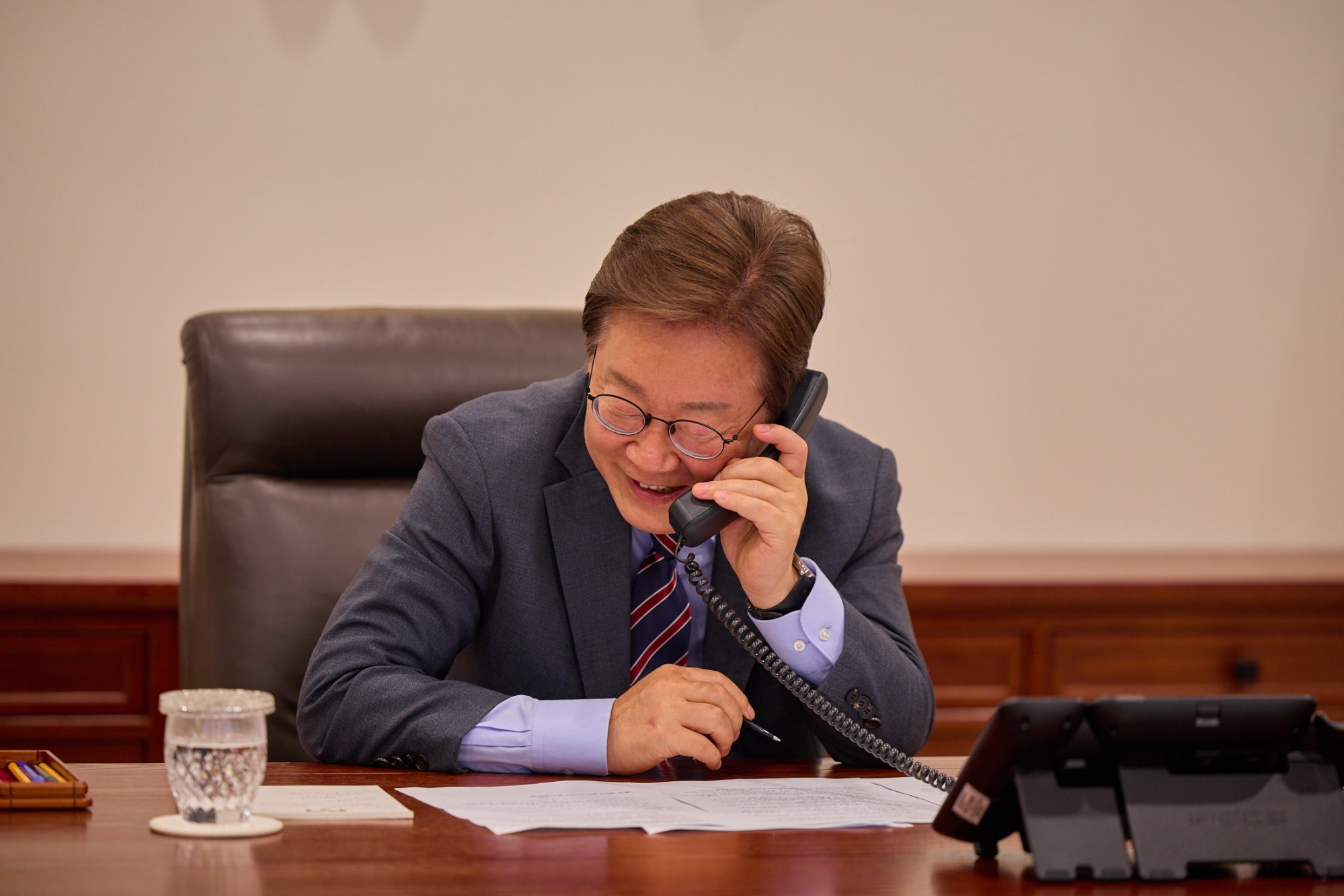 South Korean President Lee Jae-myung speaks on the phone at the presidential office in Seoul earlier this month. Photo: South Korean Presidential Office / EPA-EFE