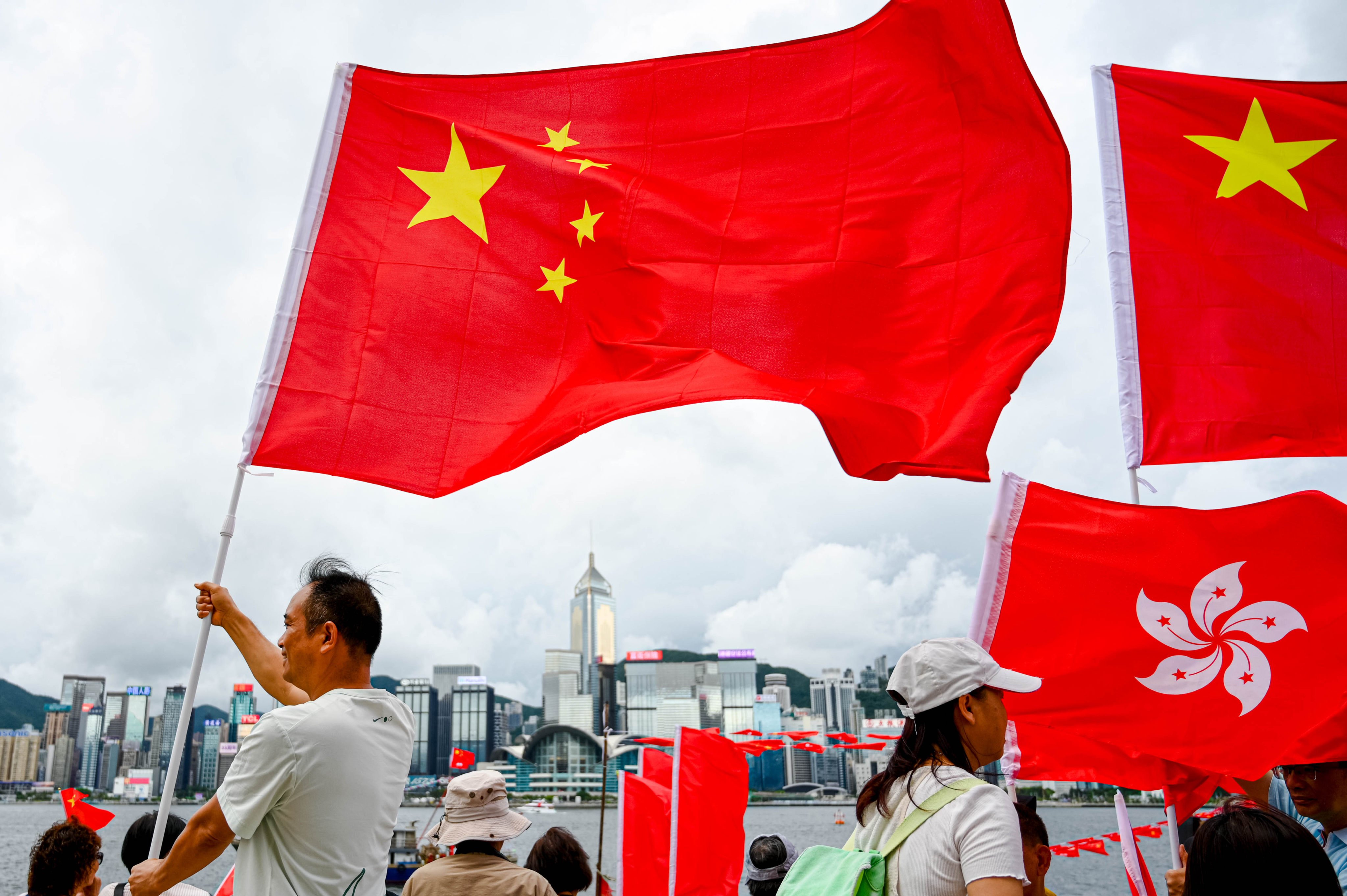 People wave the Chinese national and Hong Kong Special Administrative Region flags to celebrate the 28th anniversary of Hong Kong’s return to Chinese sovereignty, on July 1. Photo: Zuma Press Wire / dpa