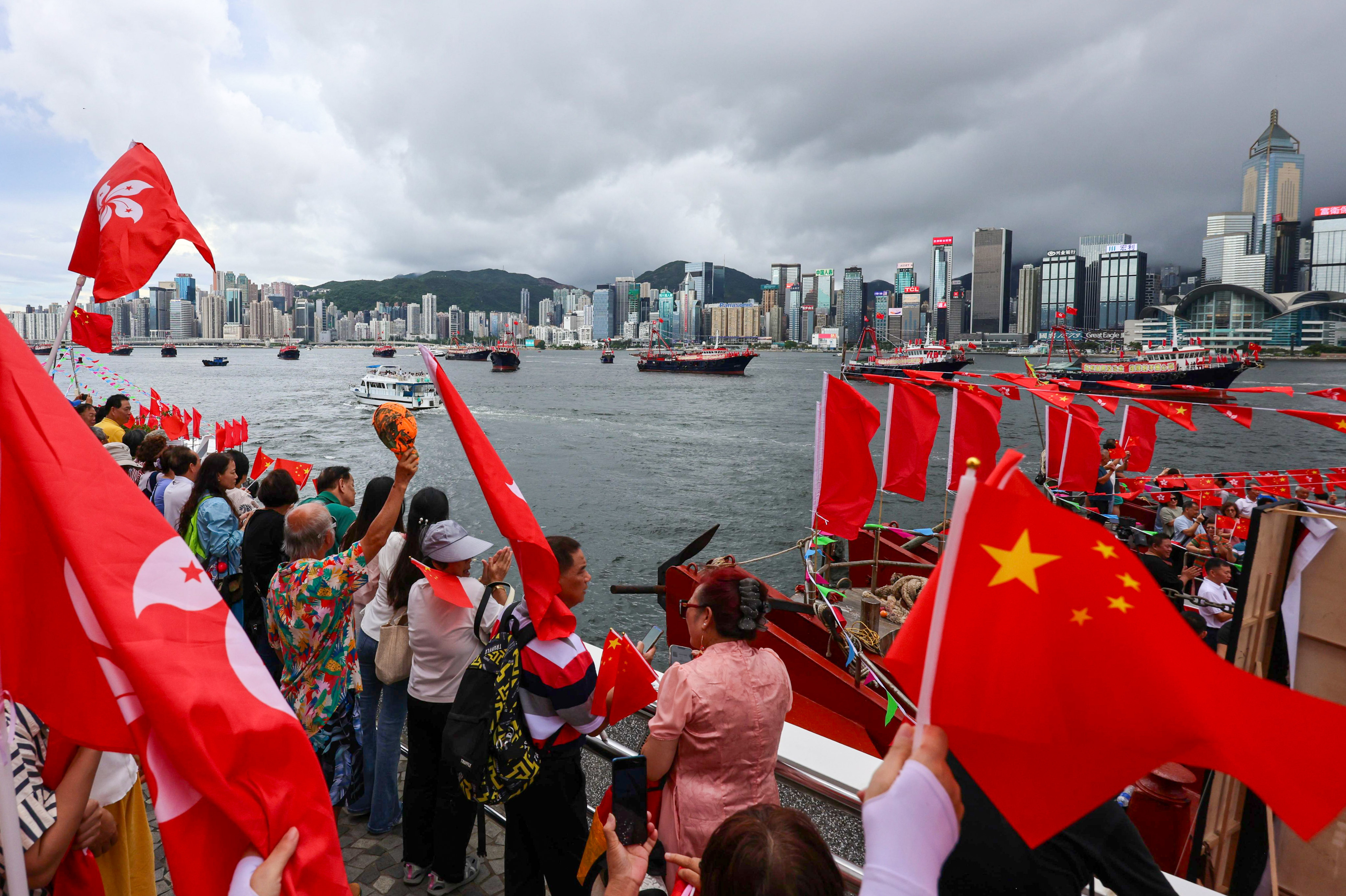 A parade of about 30 fishing boats along Victoria Harbour drew  the crowds. Photo: Jelly Tse