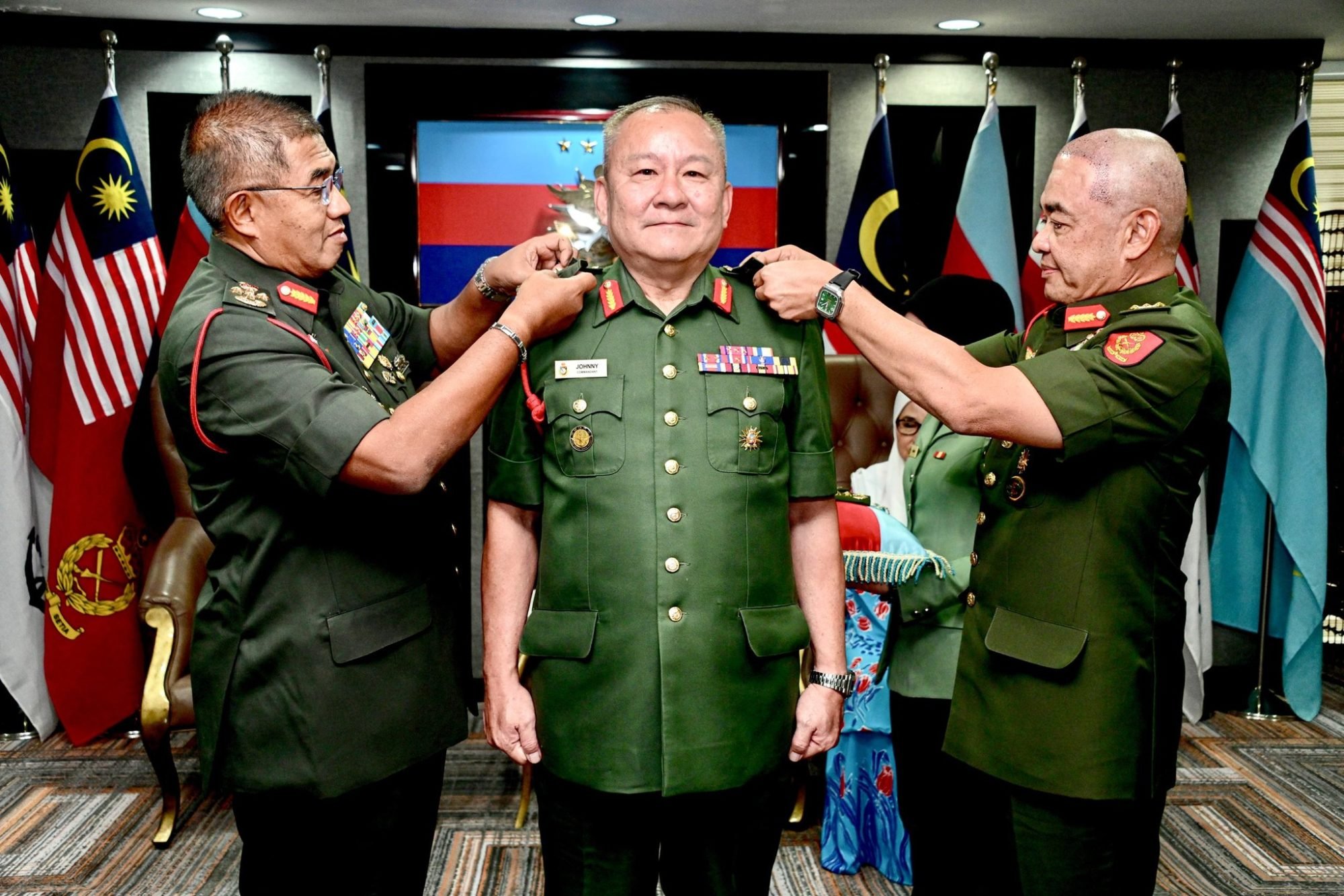 Newly minted Lieutenant General Johnny Lim Eng Seng (centre) receives his stars from Armed Forces chief General Mohd Nizam Jaffar (left) and Army Chief General Muhammad Hafizuddeain Jantan. Photo: Facebook/Malaysian Armed Forces