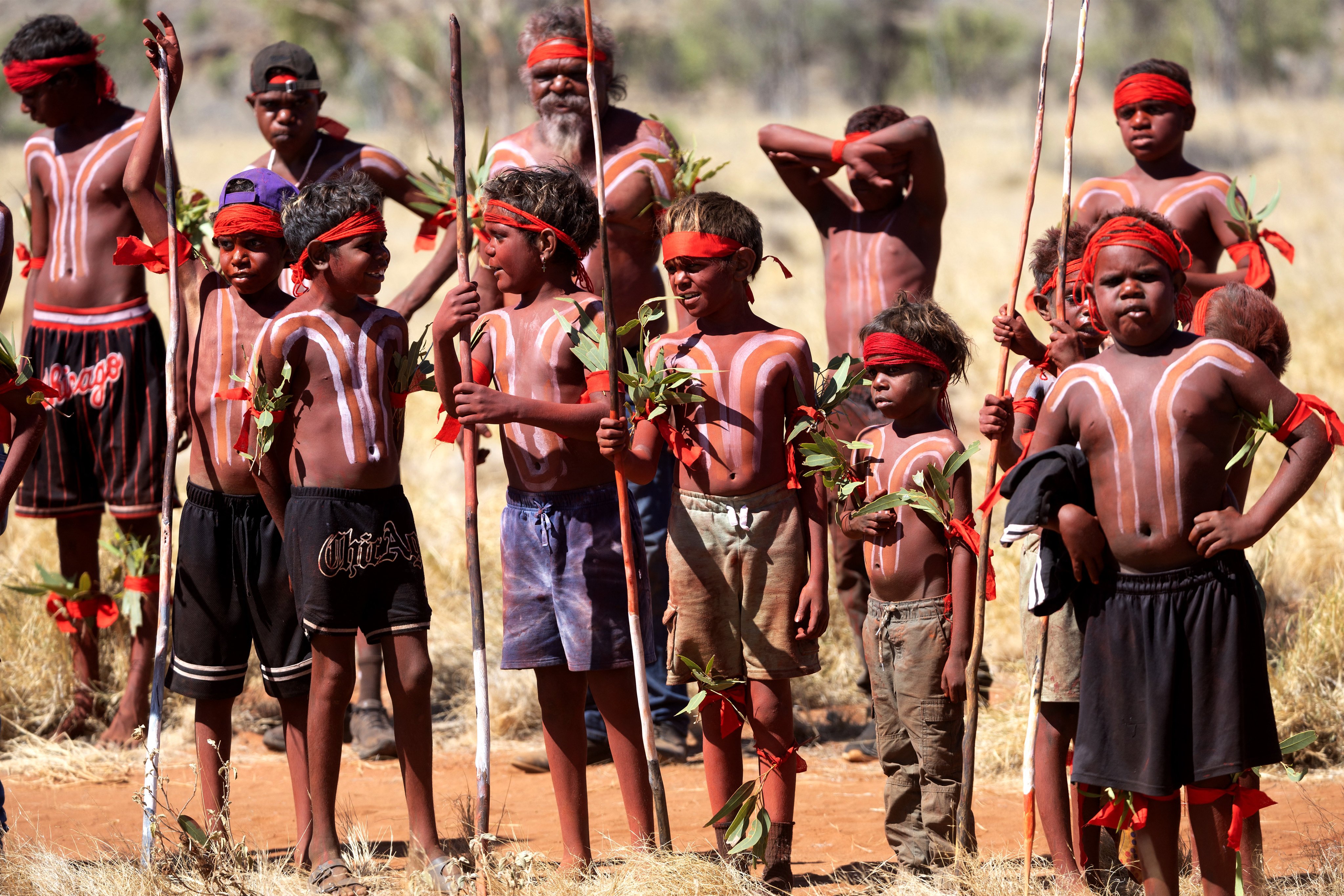Indigenous men and children prepare for a dance event in Australia’s Central Western Desert Indigenous Protected Area earlier this year. Photo: AFP