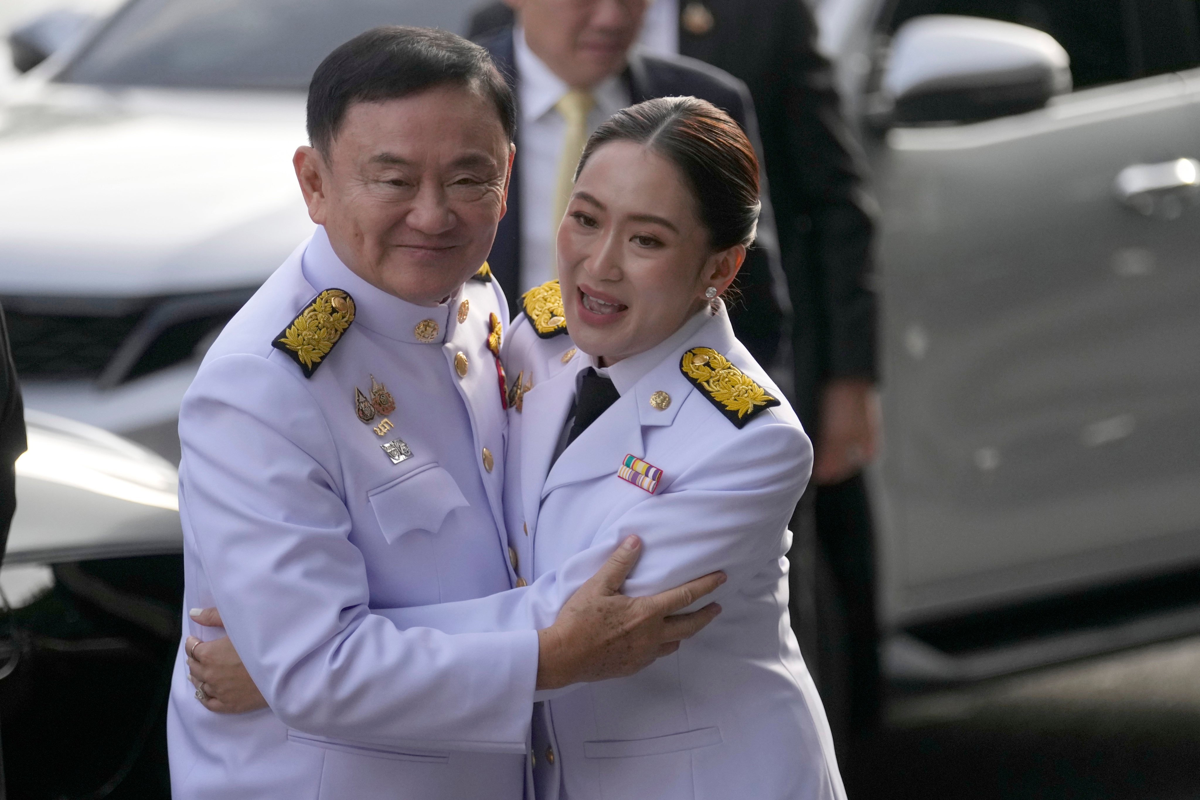 Thaksin Shinawatra (left) hugs his daughter and newly elected prime minister, Paetongtarn Shinawatra, at Pheu Thai party headquarters in Bangkok last August. Photo: AP