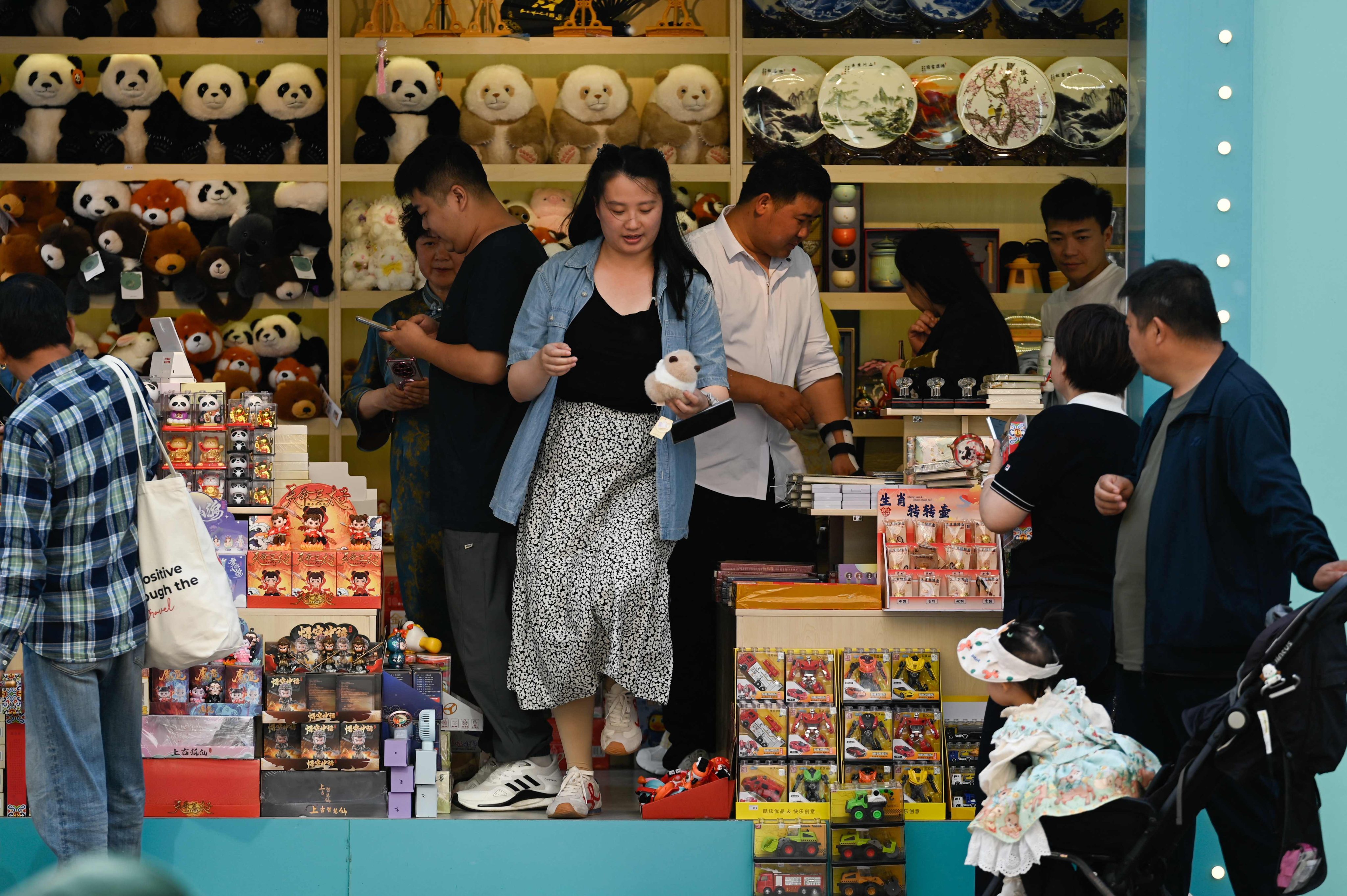 People shopping in Beijing on May 7. Photo: AFP