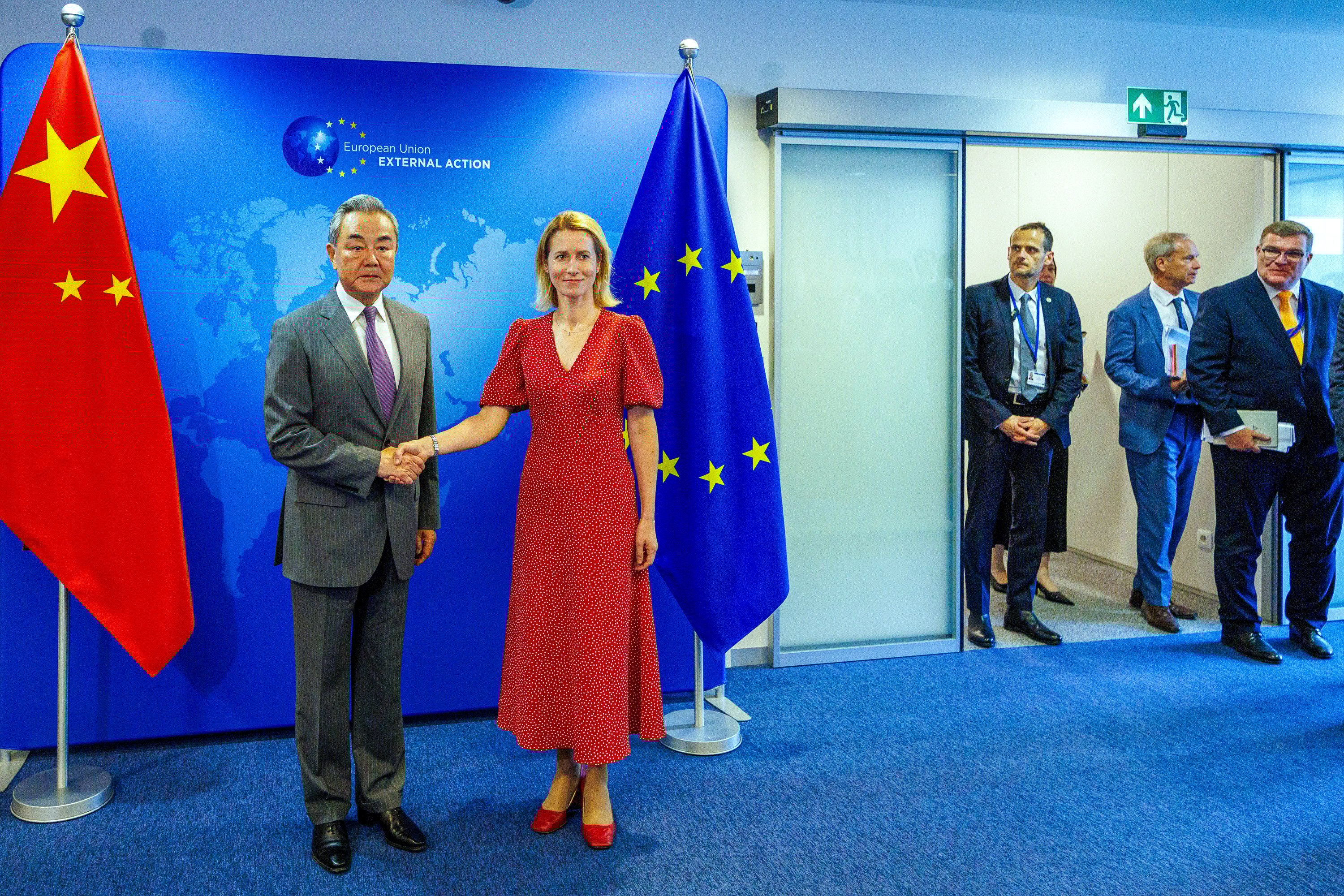 The EU’s top diplomat Kaja Kallas shakes hands with Chinese Foreign Minister Wang Yi during his visit to the EU institutions in Brussels on Wednesday. Photo: EPA