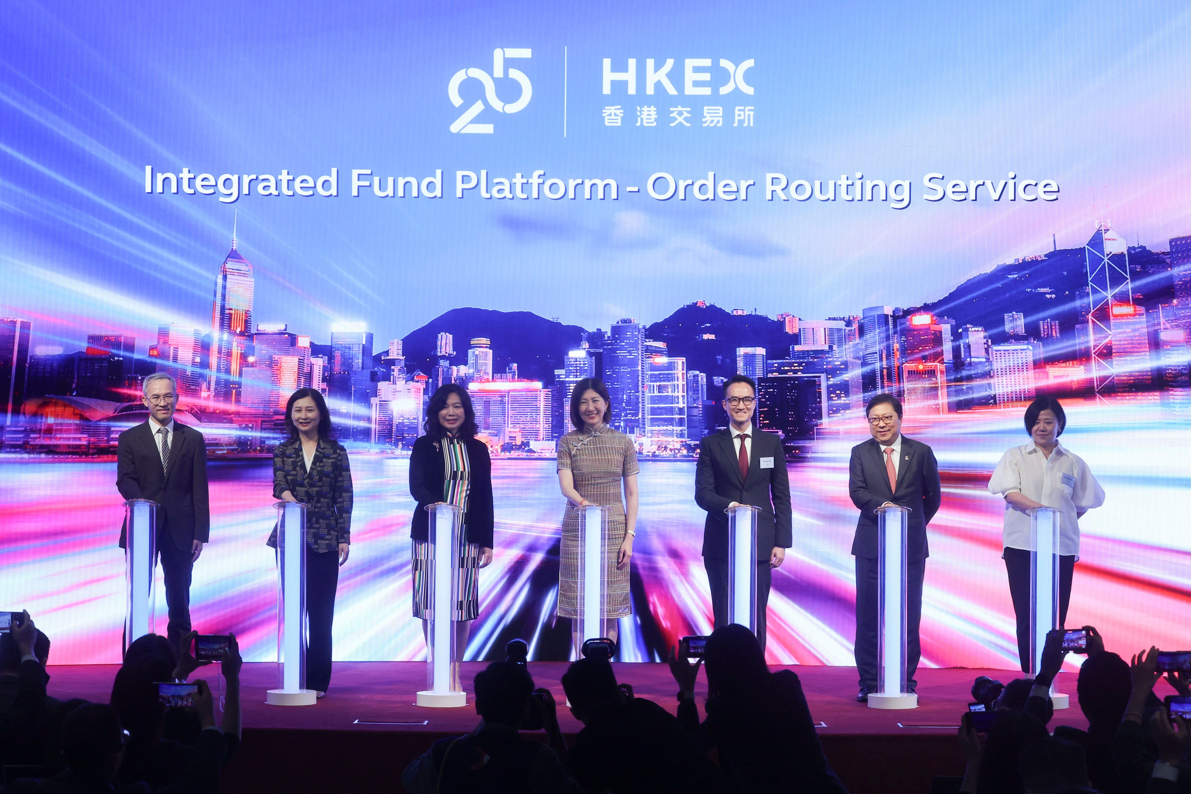 (From left) Chen Mingzhong, executive president of Shenzhen Securities Communication; Tang Rui, executive vice-president of Shenzhen Stock Exchange; Salina Yan, Permanent Secretary for Financial Services and the Treasury (Financial Services); Bonnie Chan Yiting, CEO of HKEX; Trevor Lee, senior director for investment products at  Securities and Futures Commission; Richard Leung, group CIO at HKEX; and Glenda So, head of platform and market structure development at HKEX, at the launch ceremony of a new service on the Integrated Fund Platform at the HKEX Connect Hall on Thursday. Photo: Edmond So
