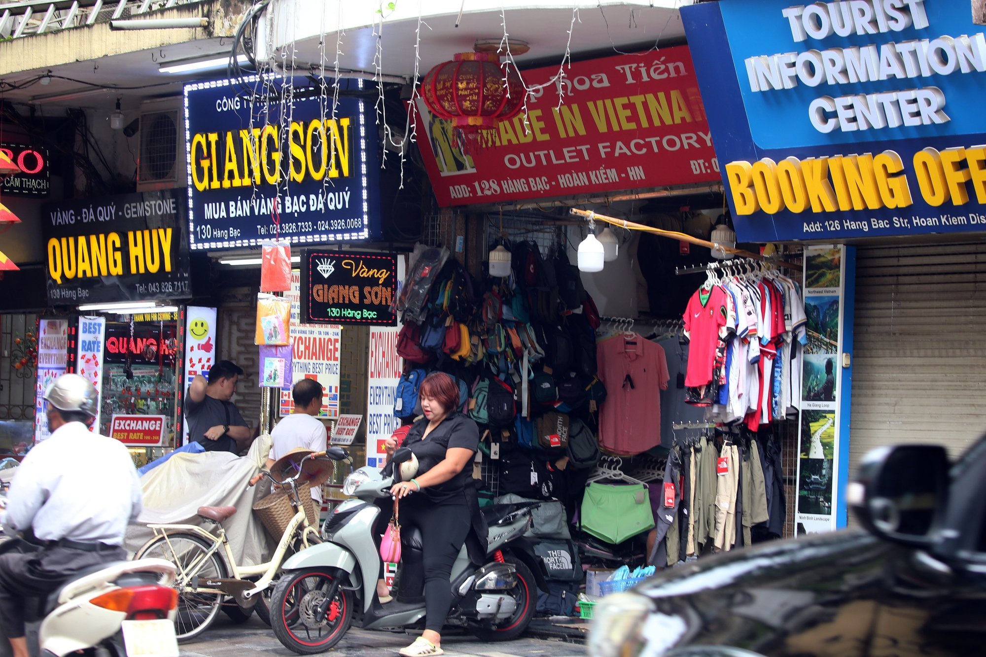 A woman parks a motorbike in front of a “Made in Vietnam” store at a street in Hanoi on Thursday. The US will impose a 20 per cent tariff on Vietnamese exports to America. Photo: EPA