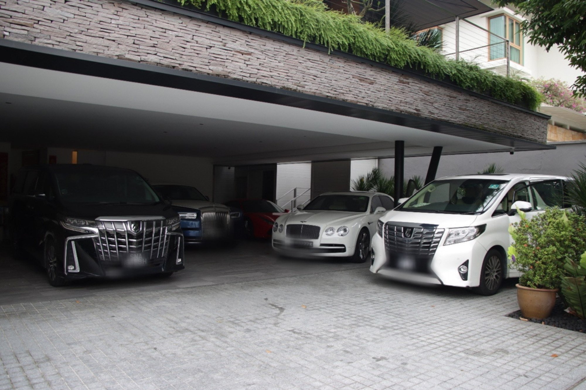 Vehicles seized during an anti-money laundering raid in Singapore in 2023. Photo: EPA-EFE Vehicles seized during an anti-money laundering raid in Singapore in 2023. Photo: EPA-EFE