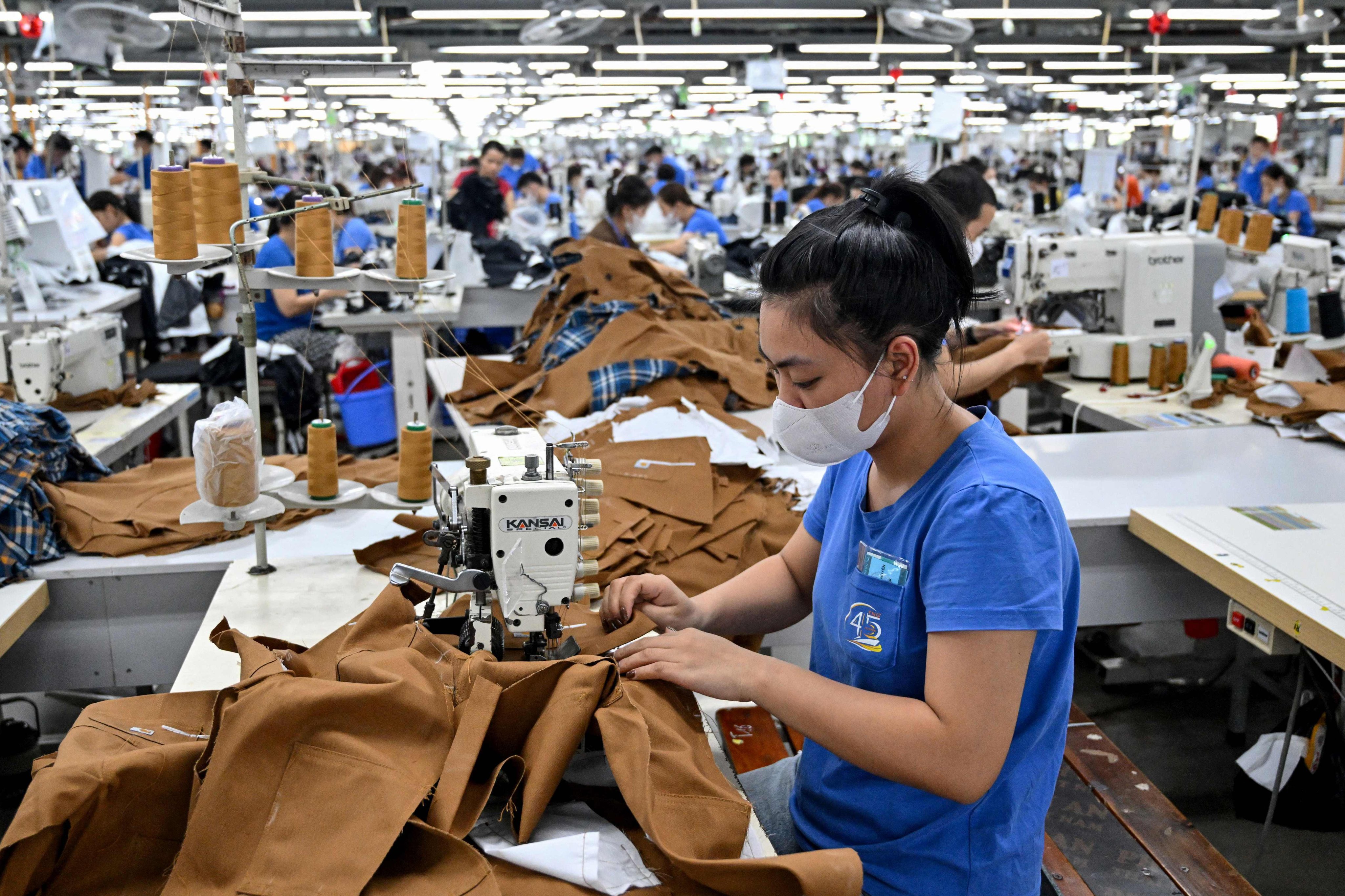 A worker stitches clothing at a garment factory in Vietnam. The United States has signed a trade deal with Vietnam that will impose 20 per cent tariffs on goods from the country. Photo: AFP