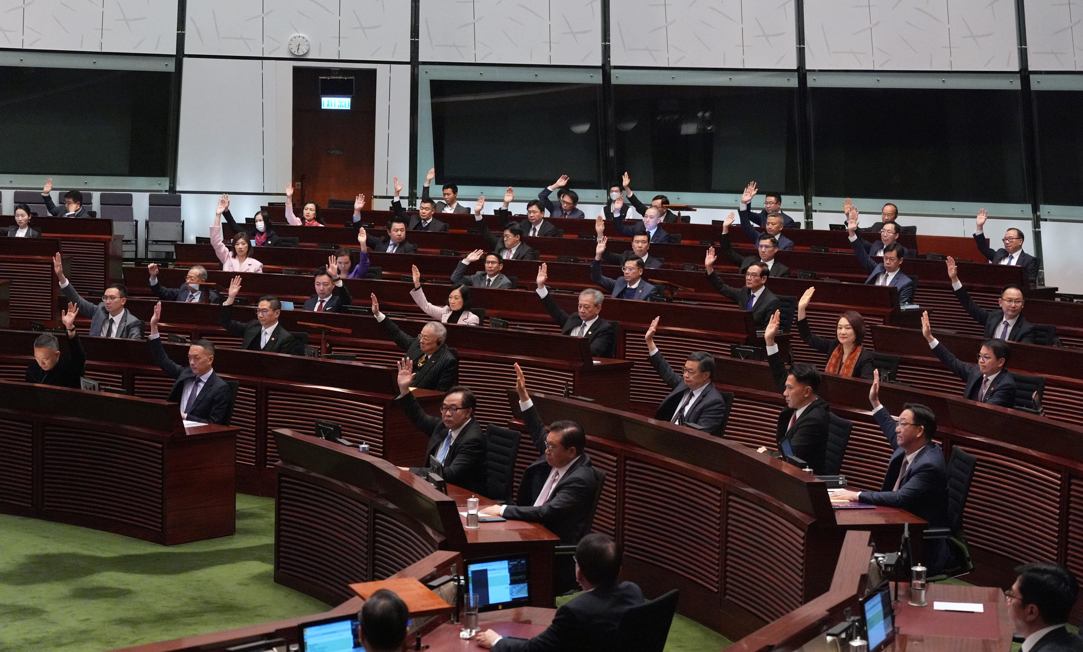 Show-of-hands voting before the third reading of the Basic Law’s Article 23 legislation at the Legislative Council in Hong Kong on the morning of March 19, 2024. Photo: Eugene Lee