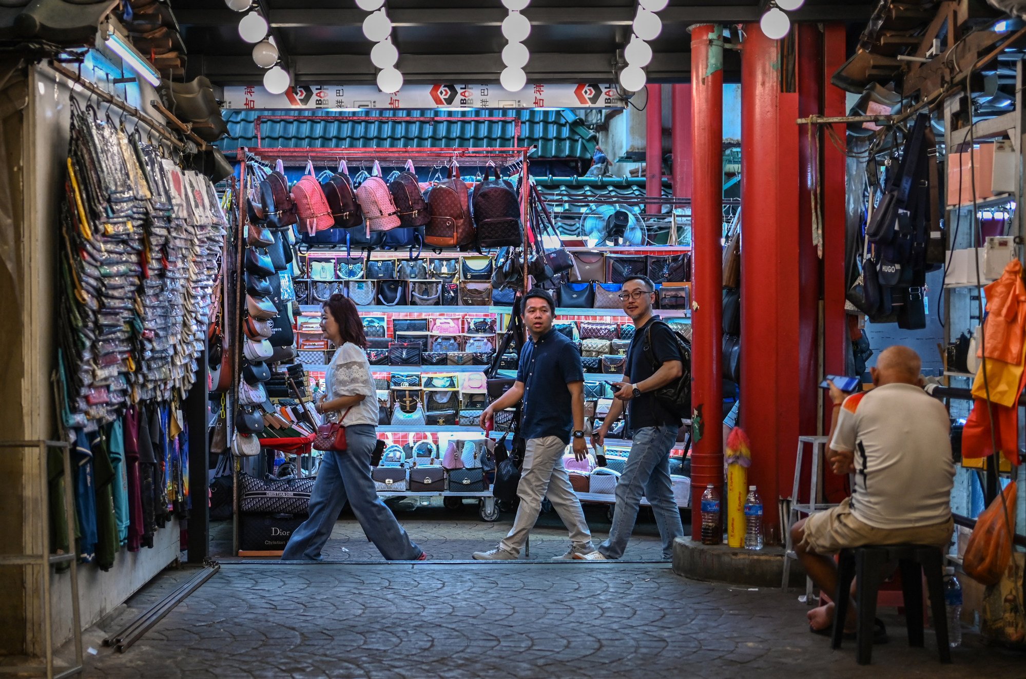 People walk through a market in Kuala Lumpur in May. Worries over rising living costs mirror trends in Malaysians’ take-home pay. Photo: AFP People walk through a market in Kuala Lumpur in May. Worries over rising living costs mirror trends in Malaysians’ take-home pay. Photo: AFP