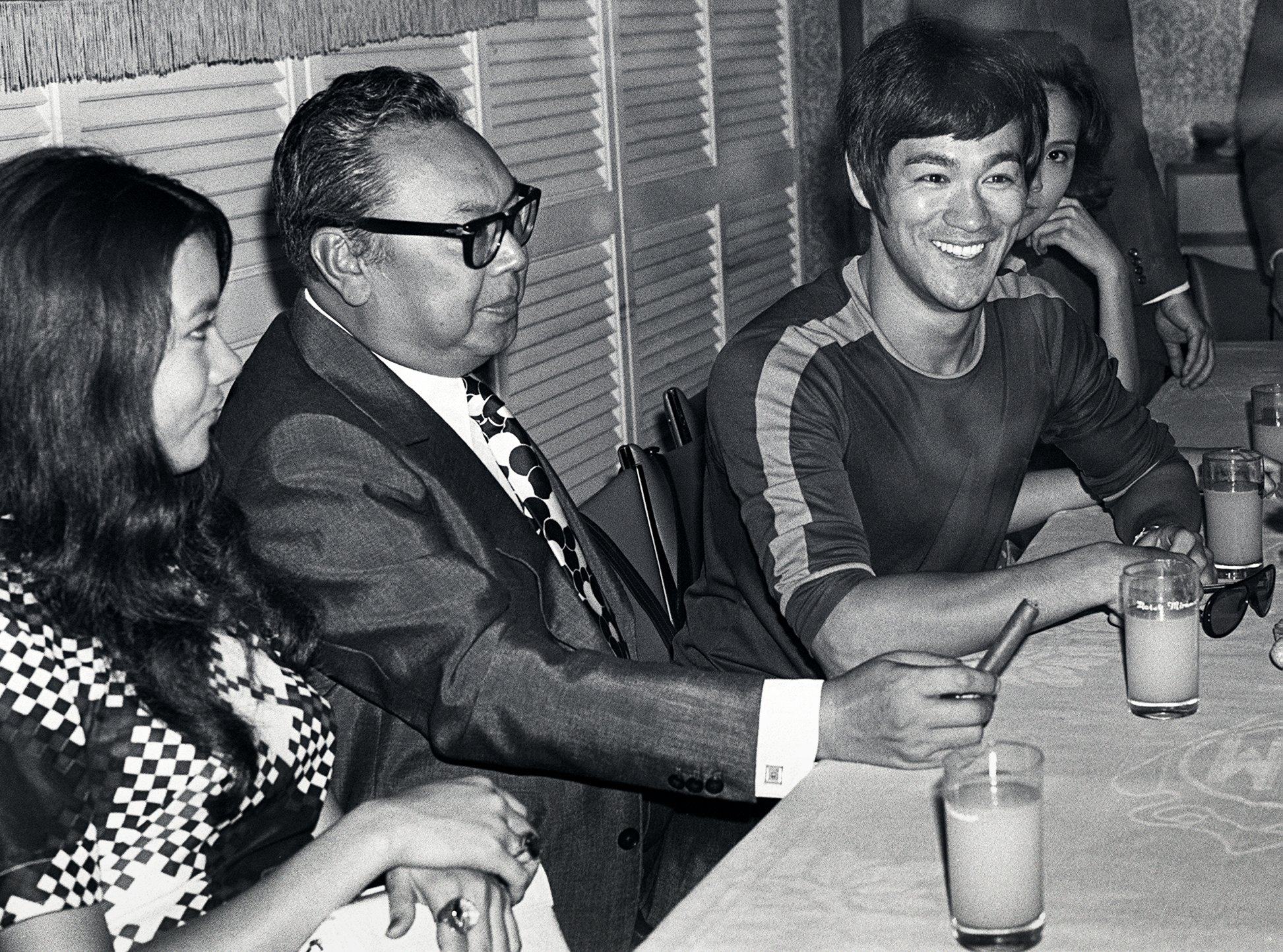 Black and white file photo of Nora Miao Ker-hsiu (left), film director Lo Wei (2nd left), and actor Bruce Lee Siu-lung [Bruce Li]. 3 Sep 71.