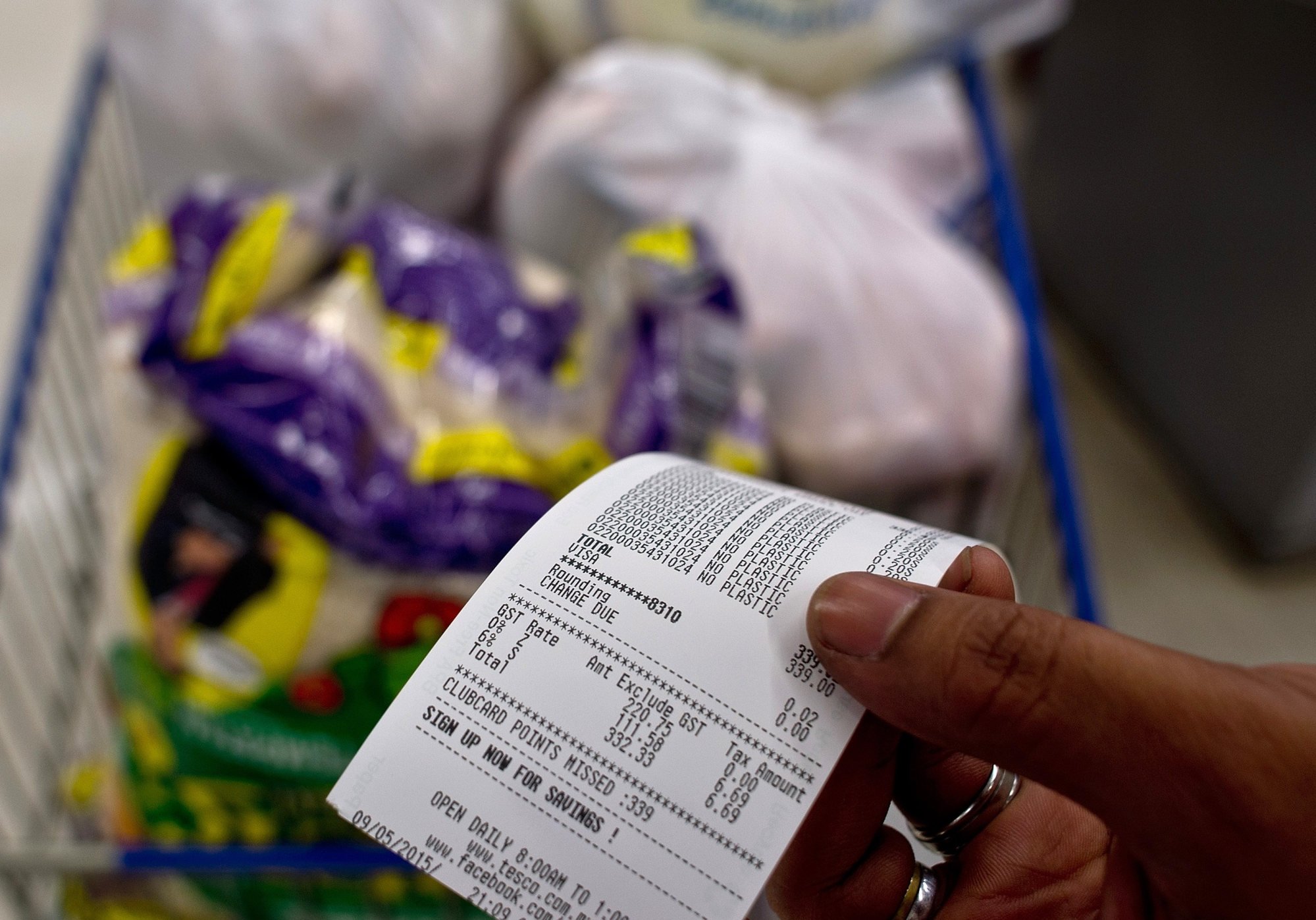 A Malaysian shopper shows his grocery receipt with the added 6 per cent goods and services tax (GST) in 2015. The unpopular tax was repealed three years later. Photo: AFP A Malaysian shopper shows his grocery receipt with the added 6 per cent goods and services tax (GST) in 2015. The unpopular tax was repealed three years later. Photo: AFP